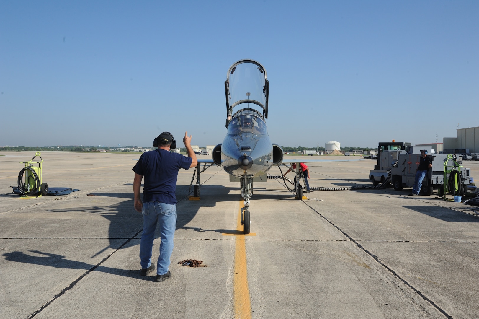 Keith Barnes (left), 571st Aircraft Maintenance Squadron contractor, performs final checks to the T-38 Talon prior to Lt. Col. Ripley Woodard, 415th Flight Test Flight commander, taking off from Joint Base San Antonio-Randolph, Texas May 17. The T-38 is being returned to Sheppard Air Force Base, Texas, after being modified by the 571st here. (U.S. Air Force photo by Rich McFadden) 