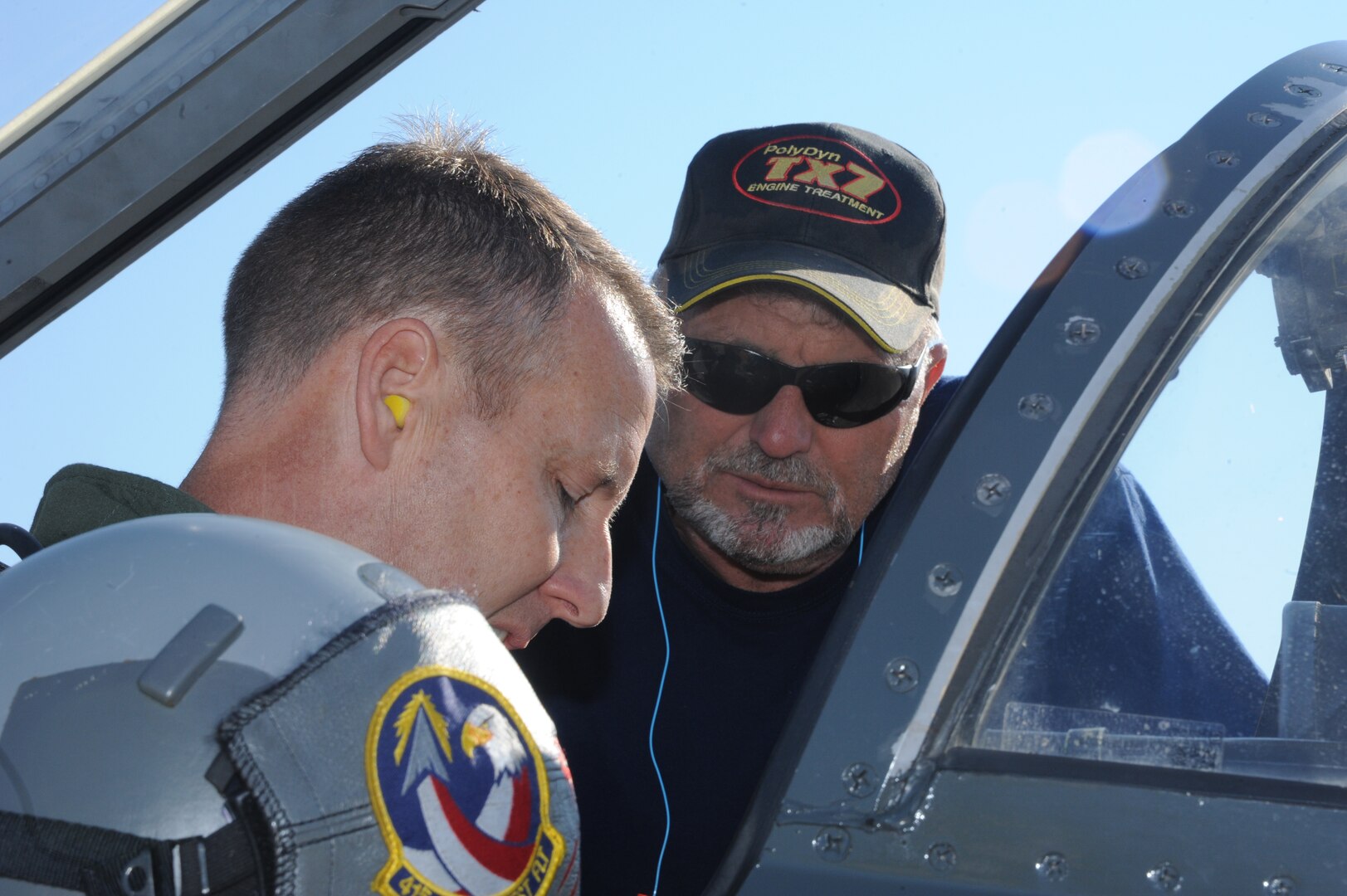 Keith Barnes (right), 571st Aircraft Maintenance Squadron contractor, helps Lt. Col. Ripley Woodard, 415th Flight Test Flight commander, strap into a T-38 Talon prior to takeoff May 17 from Joint Base San Antonio-Randolph, Texas. The T-38 is being returned to Sheppard Air Force Base, Texas, after being modified by the 571st here. (U.S. Air Force photo by Rich McFadden) 