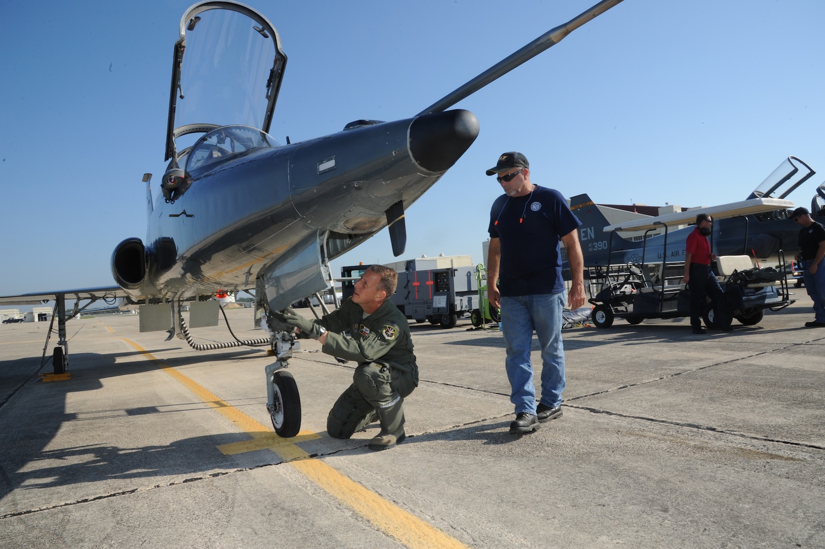 Keith Barnes (right), 571st Aircraft Maintenance Squadron contractor and Lt. Col. Ripley Woodard, 415th Flight Test Flight commander, perform checks on a T-38 Talon prior to takeoff May 17 from Joint Base San Antonio-Randolph, Texas. The T-38 is being returned to Sheppard Air Force Base, Texas after being modified by the 571st here. (U.S. Air Force photo by Rich McFadden) 