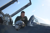 Lt. Col. Ripley Woodard, 415th Flight Test Flight commander, climbs into a T-38 Talon May 17 on Joint Base San Antonio-Randolph, Texas. The T-38 is being returned to Sheppard Air Force Base, Texas after being modified by the 571st Aircraft Maintenance Squadron here . (U.S. Air Force photo by Rich McFadden) 