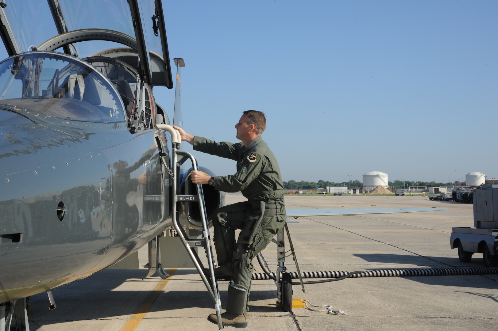Lt. Col. Ripley Woodard, 415th Flight Test Flight commander, climbs into a T-38 Talon May 17 on Joint Base San Antonio-Randolph, Texas. The T-38 is being returned to Sheppard Air Force Base, Texas after being modified by the 571st Aircraft Maintenance Squadron here . (U.S. Air Force photo by Rich McFadden) 