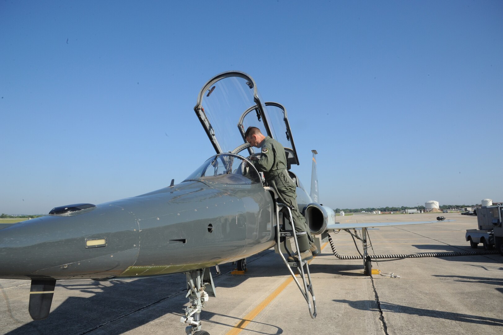 Lt. Col. Ripley Woodard, 415th Flight Test Flight commander, climbs into a T-38 Talon May 17 on Joint Base San Antonio-Randolph, Texas. The T-38 is being returned to Sheppard Air Force Base, Texas after being modified by the 571st Aircraft Maintenance Squadron here . (U.S. Air Force photo by Rich McFadden) 