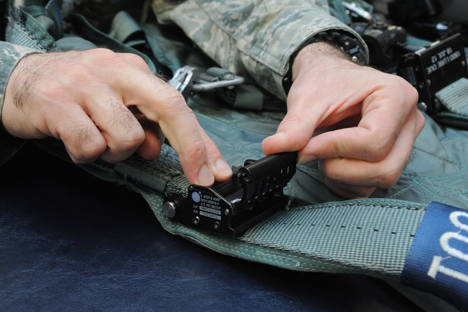 An aircrew flight equipment technician inspects and repairs harnesses used by 415th Flight Test Flight pilots May 17 on Joint Base San Antonio-Randolph, Taxas.  (U.S. Air Force photo by Rich McFadden) 