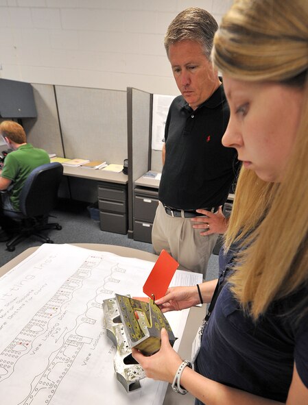Chuck Chalk (left) and Kayla Brown, engineers in the Aerospace Sustainment Directorate, review rainbow fitting inspection results. (U.S. Air Force photo by Tommie Horton)