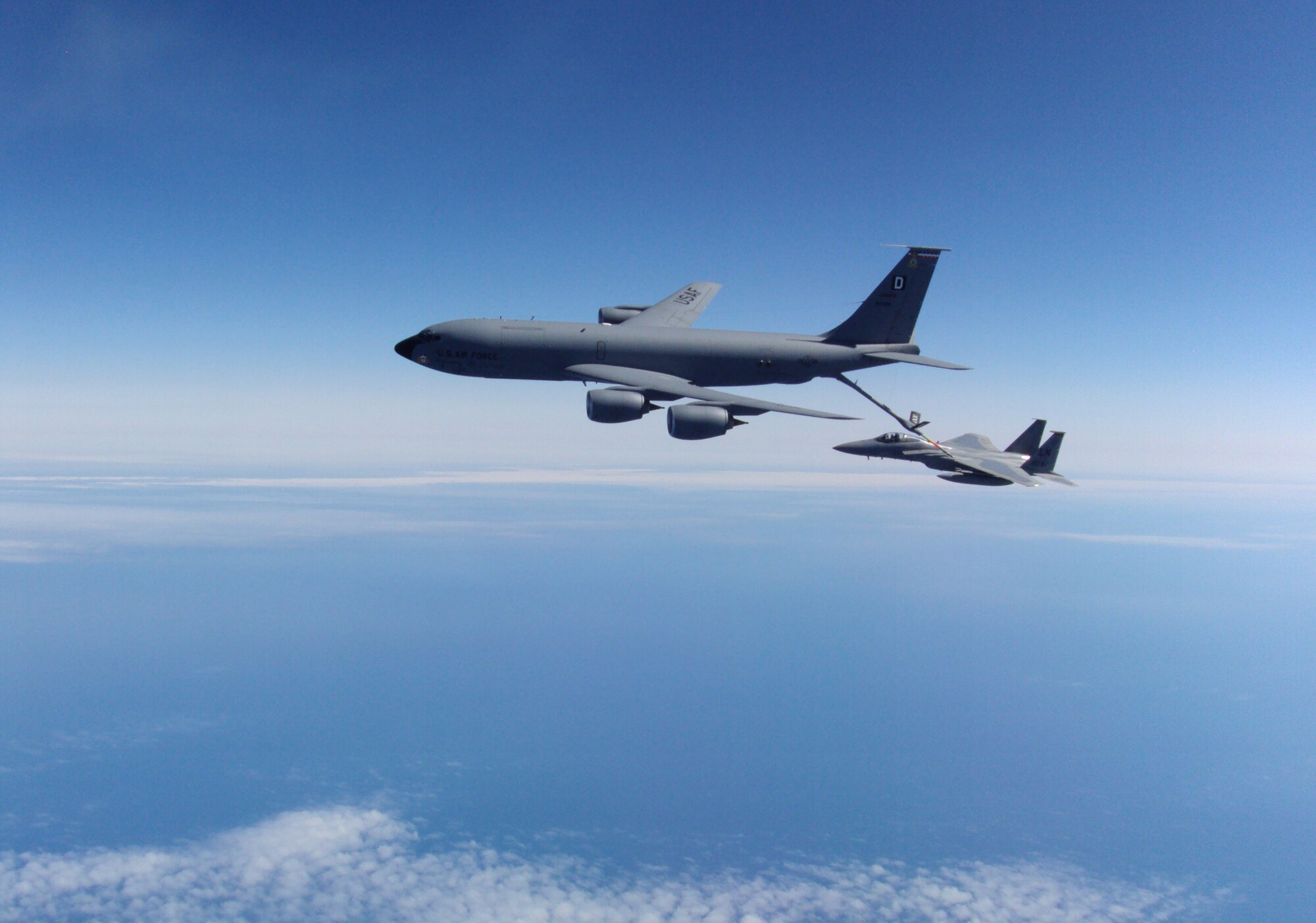KEFLAVIK, Iceland -- A KC-135 Stratotanker, deployed from Royal Air Force Mildenhall, England, refuels an F-15C Eagle, deployed from RAF Lakenheath, England, while flying an alert mission exercise with the 493rd Expeditionary Fighter Squadron in Iceland May 22, 2012.  The squadron, made up of both U.S. Air Force and NATO personnel, is fulfilling an air policing mission that assists in assuring Iceland's air sovereignty. (Courtesy photo)