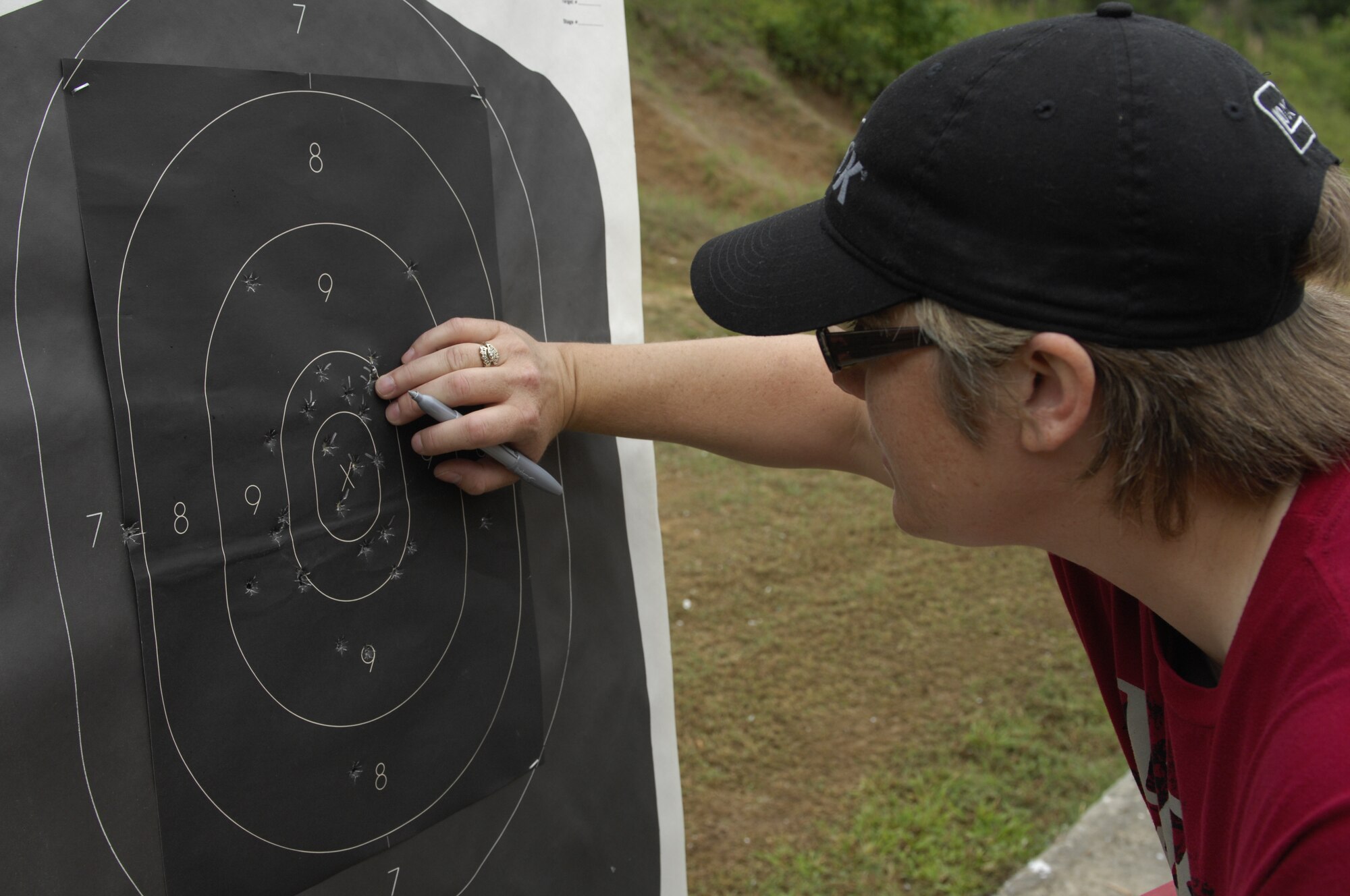 SHAW AIR FORCE BASE, S.C. – Police Lt. Misty L. Lee, Sumter County Sheriff’s Office deputy, scores target sheets for the participants of a pistol tournament that observing Police Week at the Sumter Police Department, S.C., firing range. Lee is a native of Sumter and volunteered to act as one of the many judges for the tournament. National Police Week honors the police officers and their sacrifices. It also provides an opportunity for police personnel to gather, relax and build camaraderie. (U.S. Air Force photo by Airman 1st Class Krystal M. Jeffers/Released)