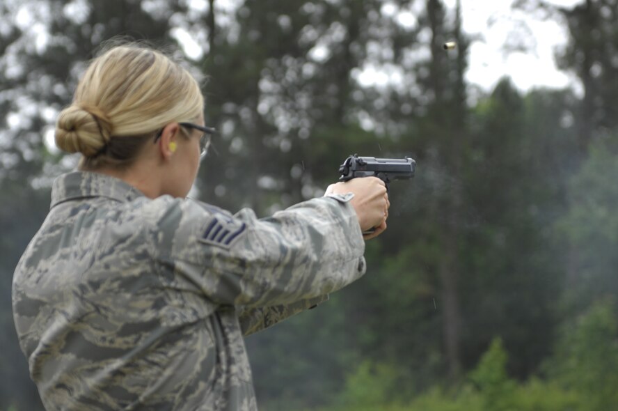 SHAW AIR FORCE BASE, S.C. – U.S. Air Force Staff Sgt. Caitlyn A. Hocott, 20th Security Forces Squadron investigator and native of Gilbert Ariz., fires her pistol in a tournament at the Sumter Police Department, S.C., firing range on May 18, 2012. The tournament was one of the events during Police Week. The others were a golf tournament at Shaw Air Force Base, and a memorial service in downtown Sumter. National Police Week was proclaimed in 1962 by President John F. Kennedy to give recognition to the police officers who sacrifice daily to promote peace. (U.S. Air Force photo by Airman 1st Class Krystal M. Jeffers/Released)