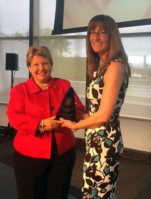 Diane P. LeBlanc (left), Greater Boston Federal Executive Board chair, presents the Administrative Professional Employee of the Year award to Bethanie Gonsalves, 66th Air Base Group Plans and Programs Human Resources advisor, during the board’s 2012 Excellence in Government Awards ceremony May 9 at the John F. Kennedy Presidential Library. Two other Hanscom employees, Investigator William Boyden, 66th Security Forces Squadron Investigations superintendant, and Ken Smith, Civil Engineering operations manager, were among the nominees. (Courtesy photo)