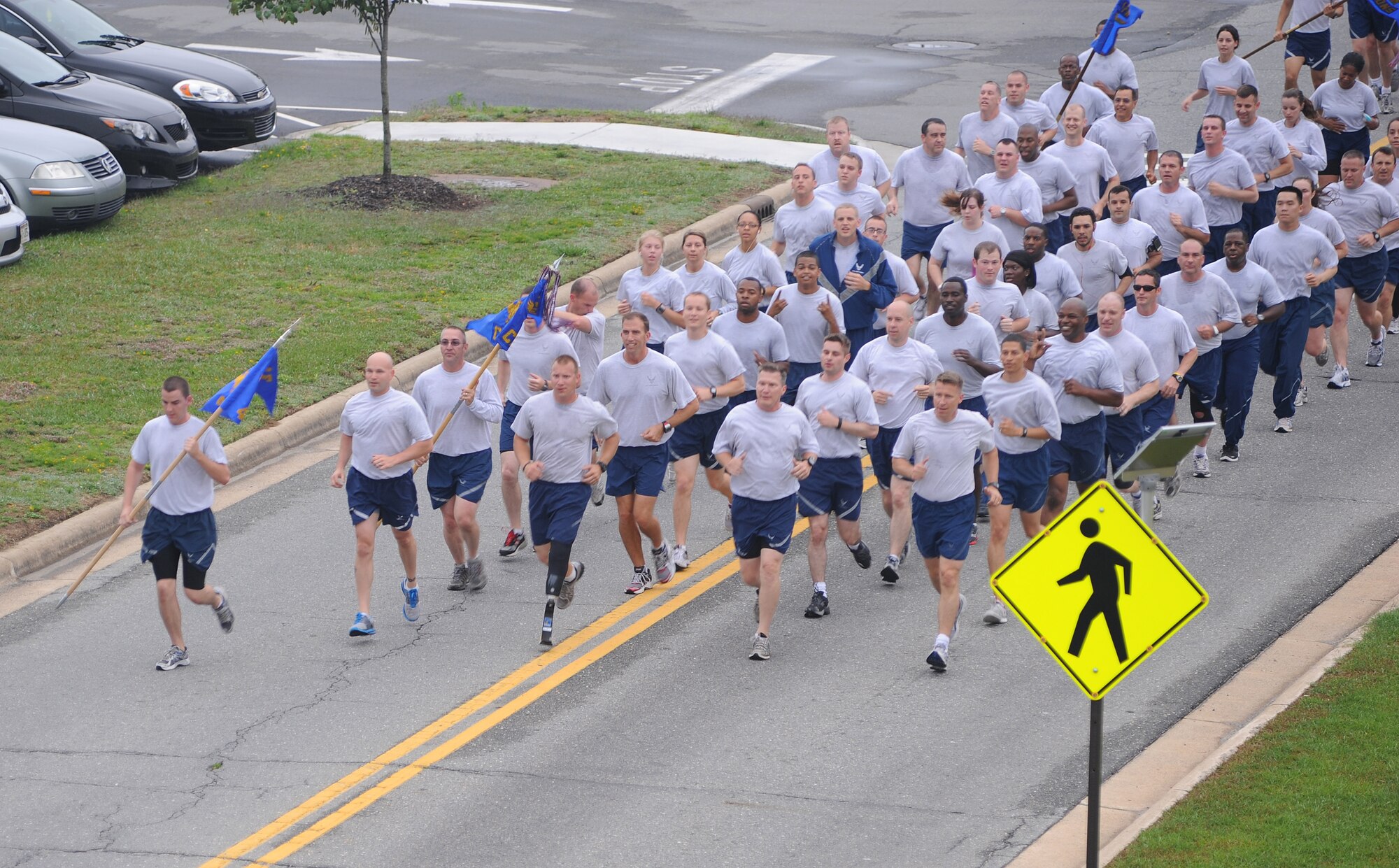 Airmen from the 4th Fighter Wing run in formation to kick-off Warrior Day on Seymour Johnson Air Force Base, N.C., May 22, 2012. Airmen took time away from daily duties enjoy a day of friendly competition. (U.S. Air Force photo/Senior Airman Gino Reyes/Released)