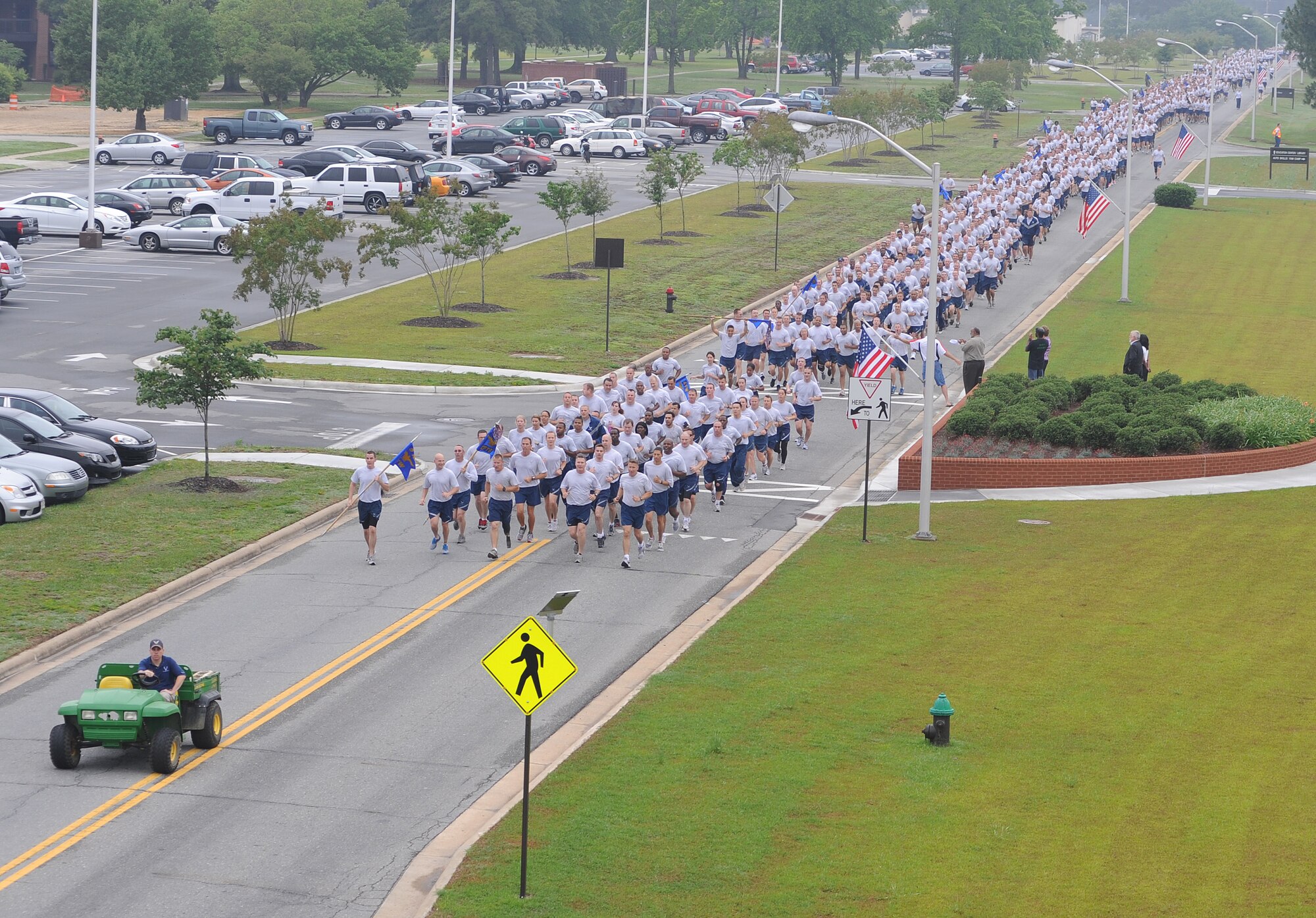 Airmen from the 4th Fighter Wing run in formation to kick-off Warrior Day on Seymour Johnson Air Force Base, N.C., May 22, 2012. Airmen took time away from daily duties enjoy a day of friendly competition. (U.S. Air Force photo/Senior Airman Gino Reyes/Released)