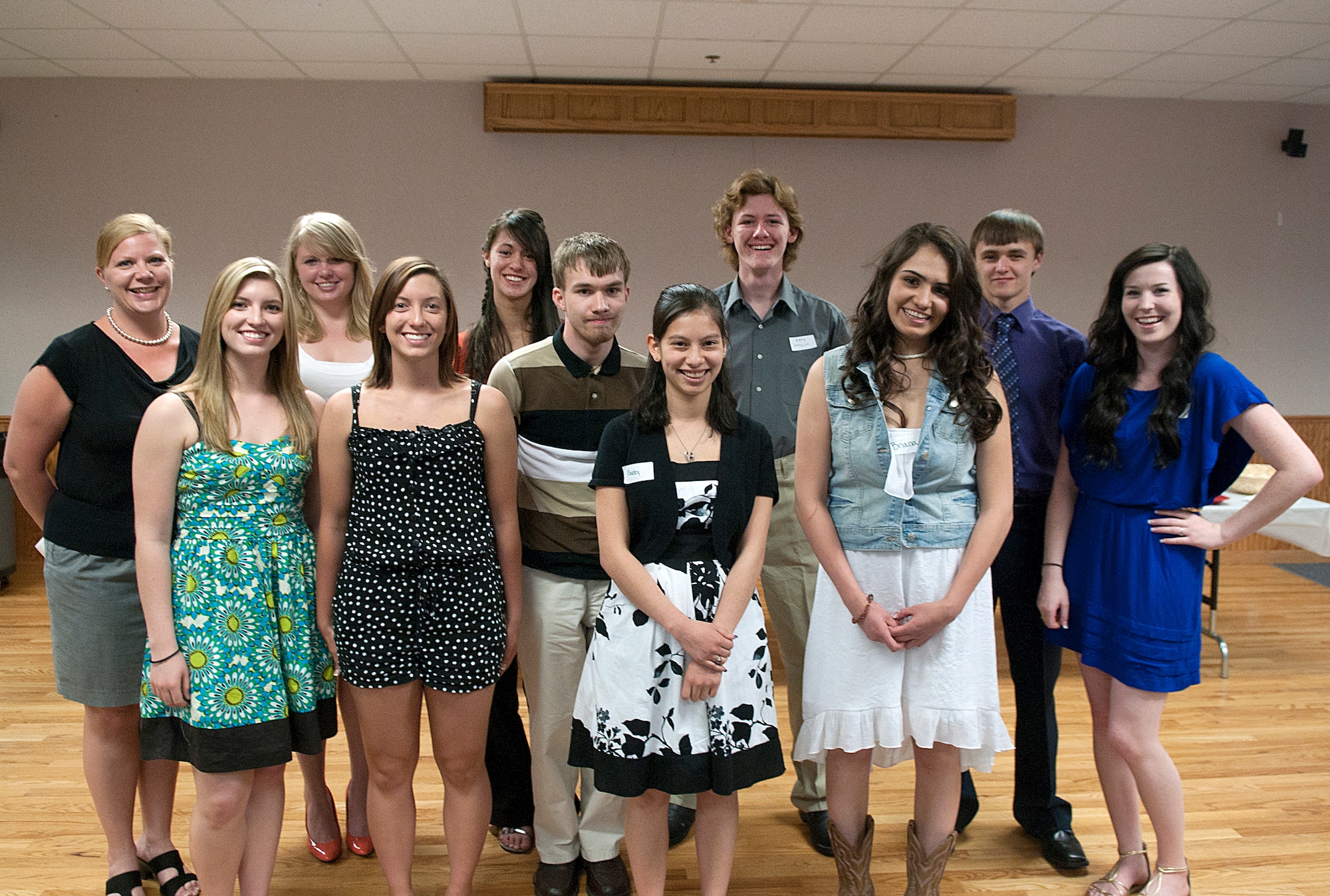 Kristie Belan, left, poses with recipients of F. E. Warren Spouses’ Club scholarships at the club’s annual scholarship luncheon May 5, in the base Chapel Activities Center. According to Belan, the club raised $20,500 for scholarships this year. The recipients are:  Briana Barker, Seth Malcom, Samantha Olive, Rachel Smith, Gabriella Vann, Alexandrea Van Lanker, Donovan Wells, Lance Pruitt, Brittany Singhas, and Amanda Olive. Awardees not pictured are Kaitlyn Ryan, Holland Zuiker, Carrie Mobley, Amanda Wilkison and Lindee Witjer. (U.S. Air Force photo by R.J. Oriez)
