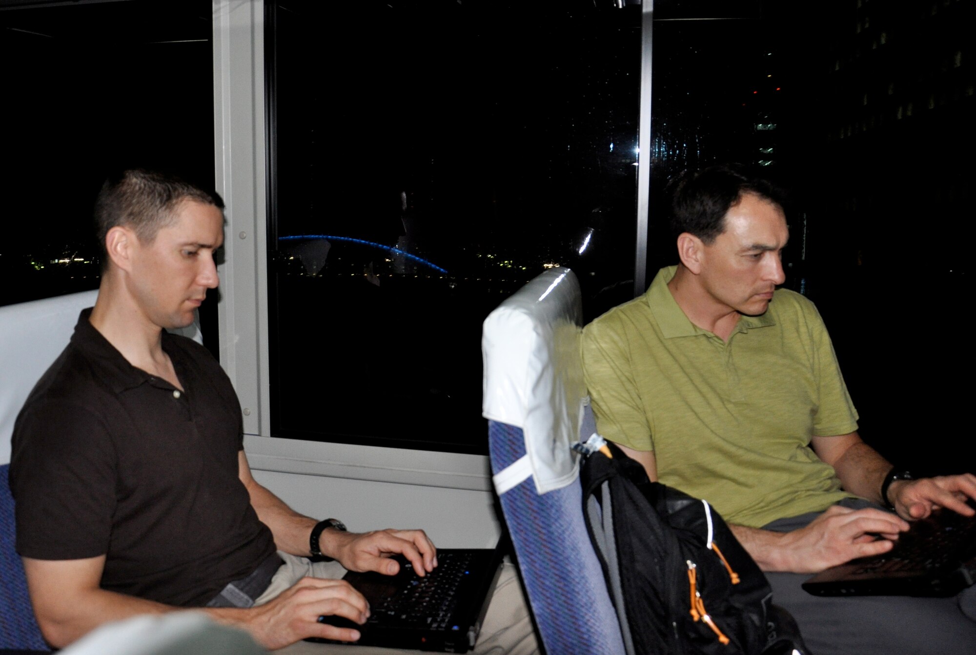 TOKYO, Japan – Immediately after landing in Tokyo, Maj. Shanon Anderson and Maj. Joseph Whittington, students in the Advanced Study of Air Mobility course offered at the U.S. Air Force Expeditionary Center, are among several of the students taking advantage of free time to continue working on their Graduate Research Projects, May 10. Including a previous three-day stop in Korea, the visit to Japan and a follow-on stop in Hawaii were all a part of the site visit portion of the ASAM course curriculum. Graduates of the program receive an accredited Master of Science in Logistics degree from the Air Force Institute of Technology.  (U.S. Air Force photo by 1st Lt. Sybil Taunton, U.S. Air Force Expeditionary Center public affairs)