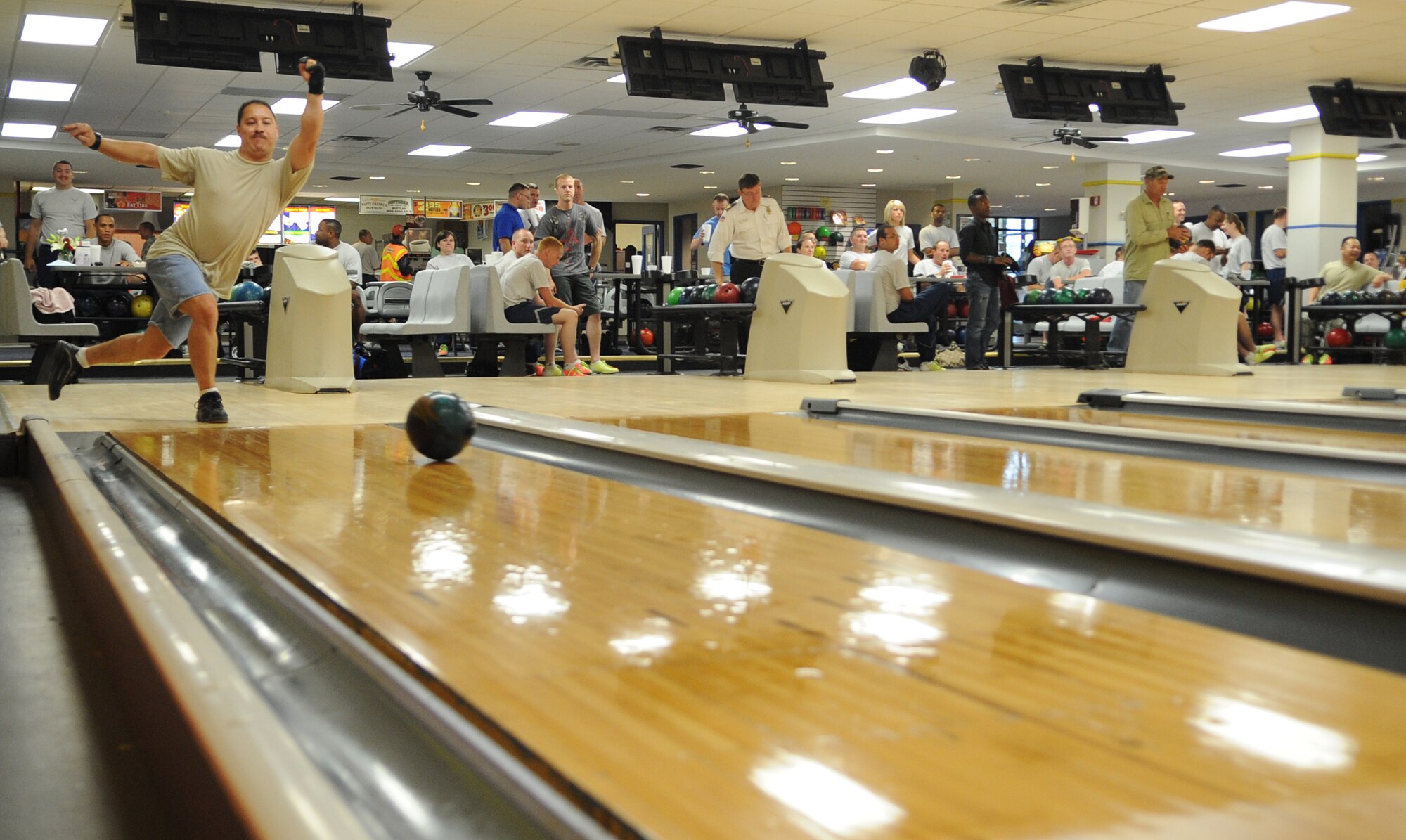 U.S. Air Force Master Sgt. Myron Malit bowls during Warrior Day on Seymour Johnson Air Force Base, N.C., May 21, 2012. Warrior Days build camaraderie among Airmen and gives them a break from their daily duties. Malit, 336th Aircraft Maintenance Unit weapons section chief, is a native of Baltimore. (U.S. Air Force photo/Airman 1st Class Aubrey Robinson/Released)