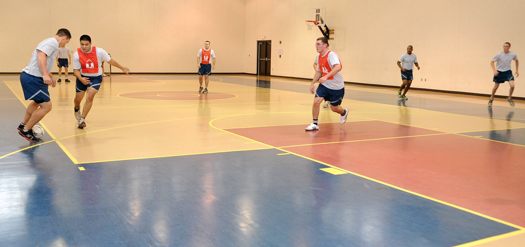 U.S. Air Force Airmen assigned to the 4th Communications and Equipment Maintenance Squadrons play indoor soccer during Warrior Day on Seymour Johnson Air Force Base, N.C., May 21, 2012. During Warrior Day Airmen around the base were given the opportunity to participate in various sporting events. (U.S. Air Force photo/Airman 1st Class Aubrey Robinson/Released) 