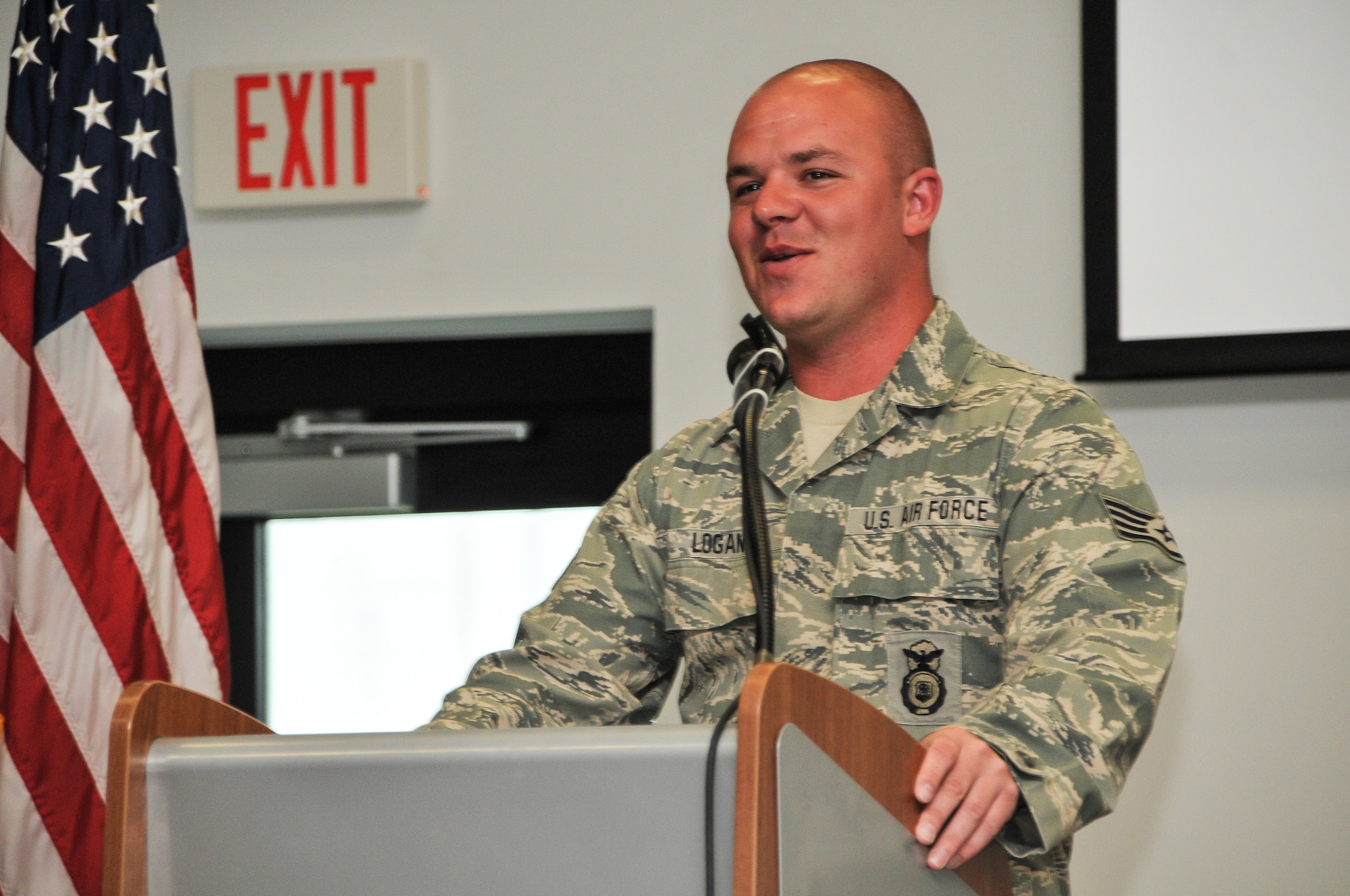 National Guard Staff Sgt. Russell Logan from the 164th Security Forces Squadron, Tennessee Air National Guard, speaks to Airmen of the 165th Airlift Wing at the Georgia Air National Guard base at Savannah/Hilton Head International Airport in Savannah, Ga., May 22, 2012. Logan's left leg was amputated due to wounds resulting from a detonated landmine at Bagram Airfield in Afghanistan. (National Guard photo by Tech. Sgt. Charles Delano/Released)