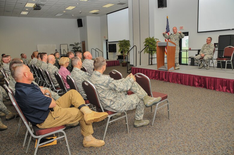 National Guard Staff Sgt. Russell Logan from the 164th Security Forces Squadron, Tennessee Air National Guard, addresses the 165th Airlift Wing Airmen at the Georgia Air National Guard base at Savannah/Hilton Head International Airport in Savannah, Ga., May 22, 2012. Logan's left leg was amputated due to wounds resulting from a detonated landmine at Bagram Airfield in Afghanistan. (National Guard photo by Tech. Sgt. Charles Delano/Released)