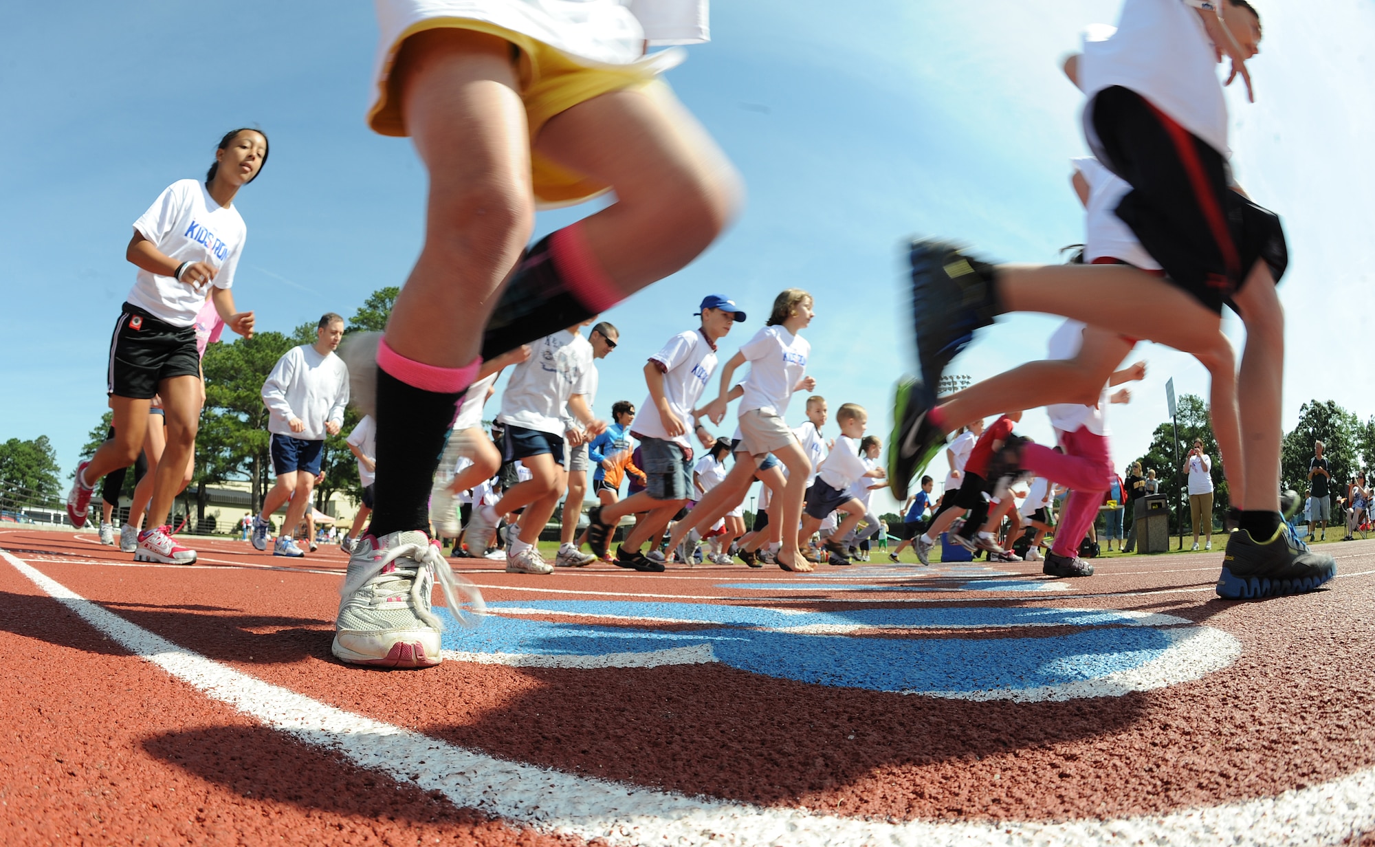 Team Seymour families begin a one-mile race during the America’s Armed Forces Kids Run event on Seymour Johnson Air Force Base, N.C., May 19, 2012. Special Olympics children were invited to run during each race as well as participate in games afterwards. (U.S. Air Force photo/Airman 1st Class Aubrey Robinson/Released)