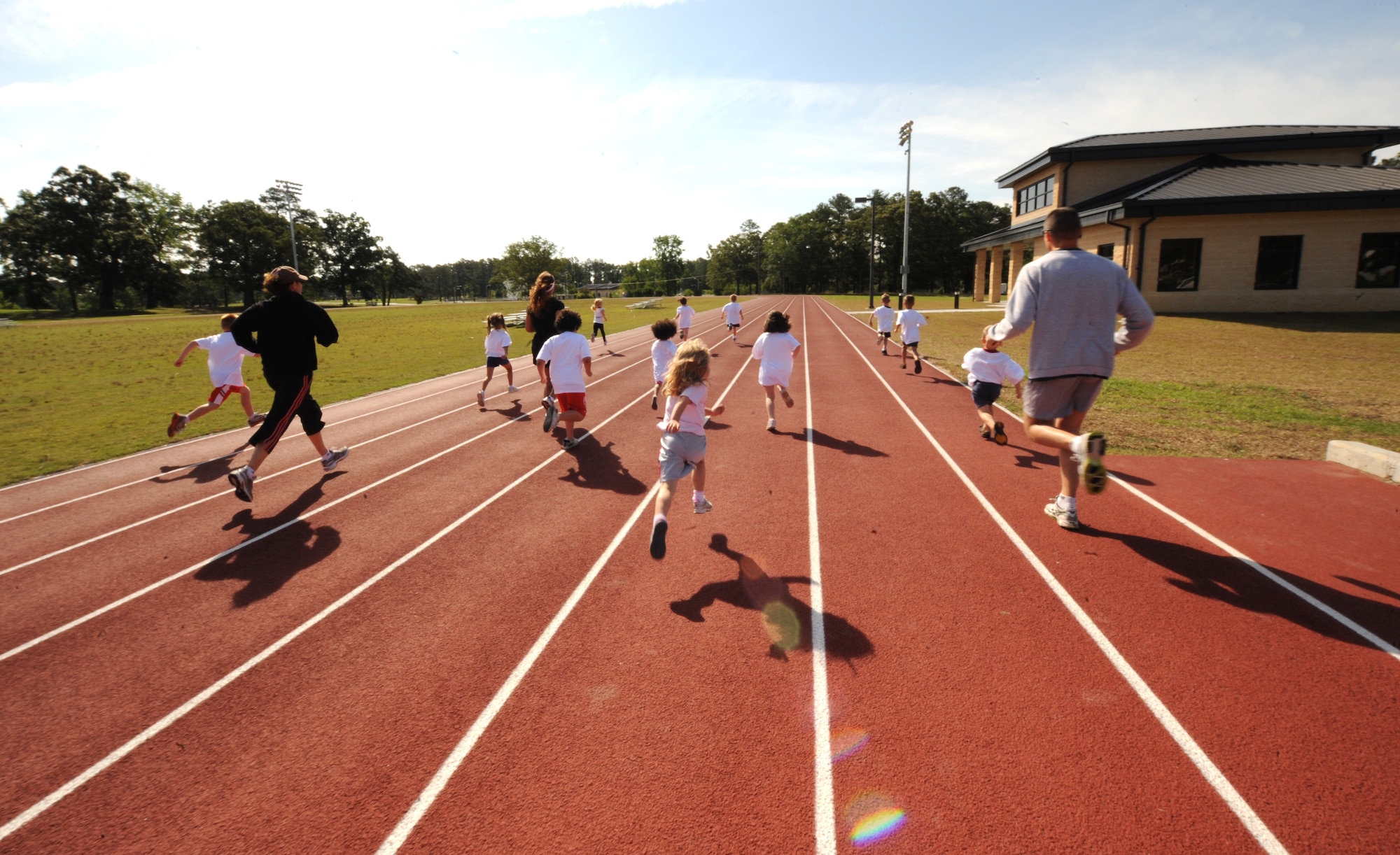 Team Seymour families run a one-mile race during America’s Armed Forces Kids Run on Seymour Johnson Air Force Base, N.C., May 19, 2012. As a part of Armed Forces Day, military families participated in the run held by the 4th Force Support Squadron. (U.S. Air Force photo/Airman 1st Class Aubrey Robinson/Released)