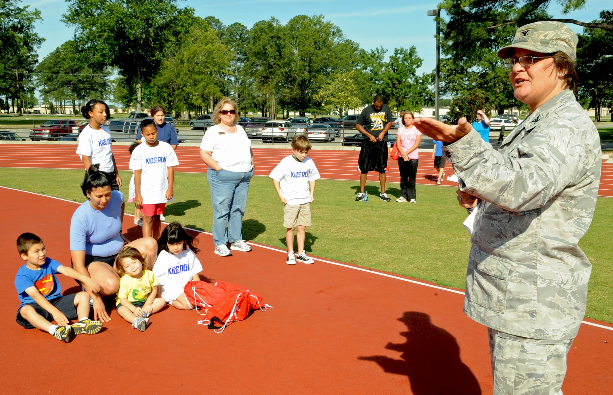 U.S. Air Force Col. Anne Winkler opens the America’s Armed Forces Kids Run event with a speech on Seymour Johnson Air Force Base, N.C., May 19, 2012. Airmen and Department of Defense civilians assigned to the 4th Force Support Squadron hosted the event for military families. Winkler, 4th Mission Support Group commander, is a native of Kansas City, Mo. (U.S. Air Force photo/Airman 1st Class Aubrey Robinson/Released)