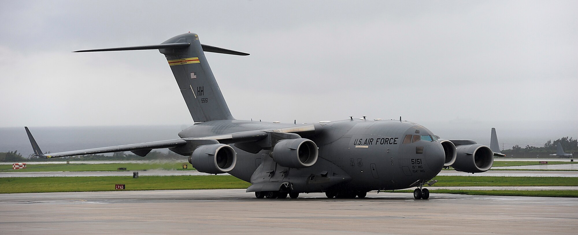 A U.S. Air Force C-17 Globemaster III cargo aircraft - carrying Airmen from the 33rd Rescue and 718th Aircraft Maintenance squadrons returning from a deployment - taxis on the Kadena Air Base, Japan, runway May 20, 2012. About 50 Airmen aboard the aircraft returned May 20 from a four-month deployment. (U.S. Air Force photo/Airman 1st Class Maeson L. Elleman)