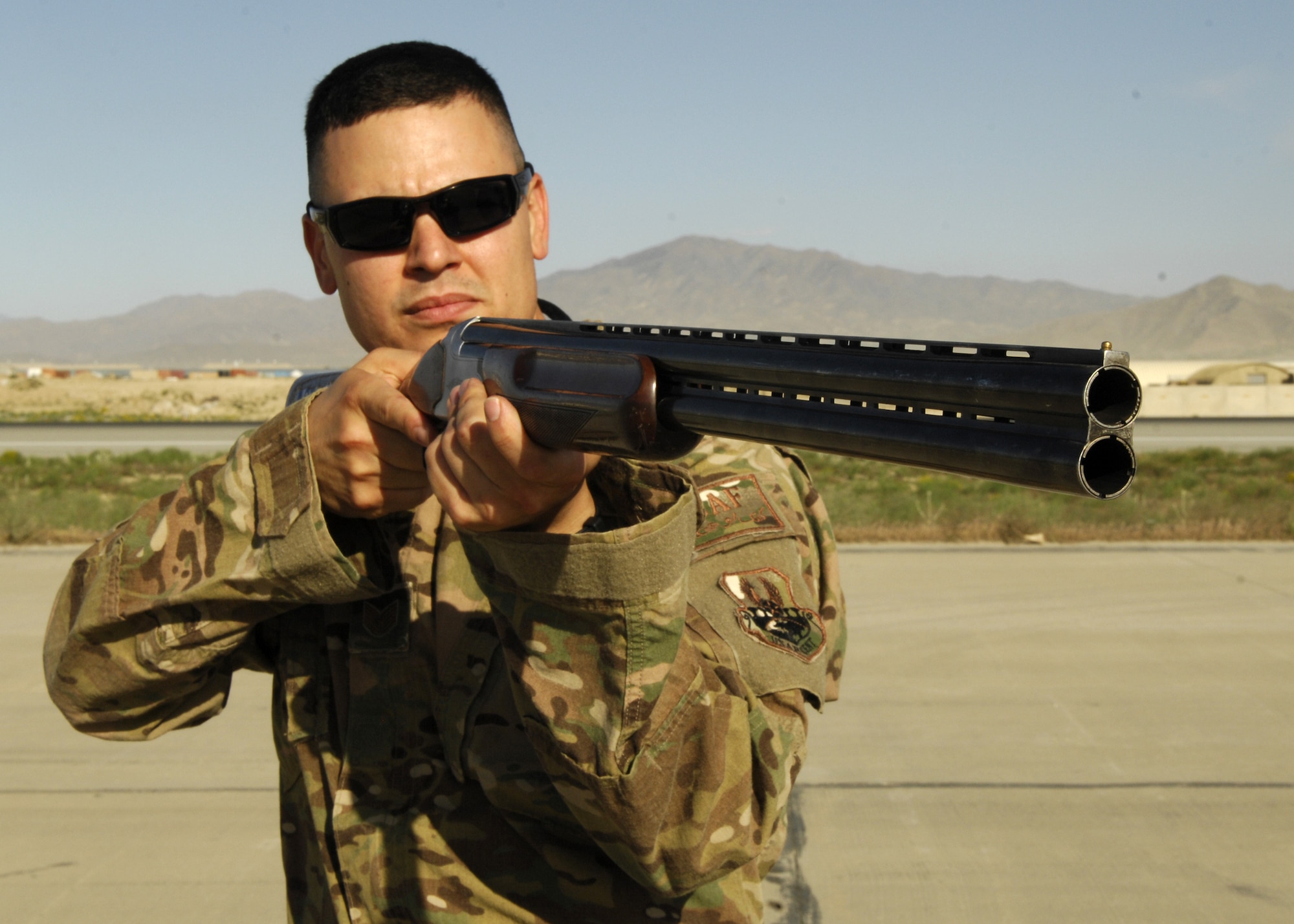 Tech. Sgt. Vincent Garcia, 455 AEW Flight Safety noncommissioned officer in charge, simulates bird depredation on Bagram Airfield to mitigate bird strike hazards with aircraft. Garcia was presented the Warrior of the Week award for his outstanding performance as maintenance investigating member in charge of mishap reports for higher headquarters. Garcia developed and implemented the wing's flight safety program, to include operational risk management, trend analysis and spot inspections. His expert knowledge of safety regulations and local requirements are reflected in reduced mishap rates across the entire airfield and on various combat airframes. (U.S. Air Force photo/Staff Sgt. Jeff Nevison)