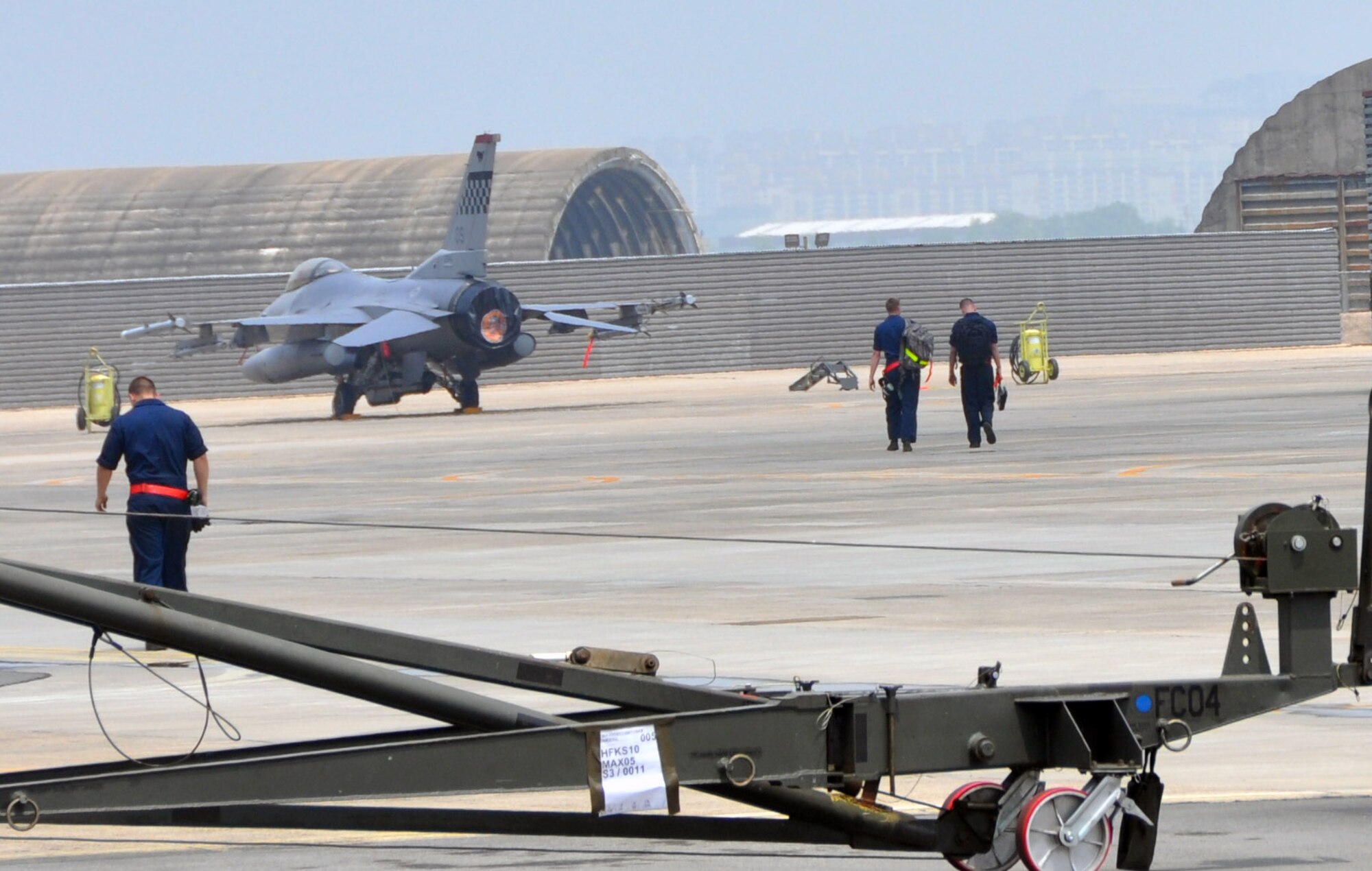 Crew chiefs assigned to Osan Air Base return to the flight line to recover F-16 Fighting Falcons during exercise Max Thunder 12-1 at Gwangju Air Base, Republic of Korea, May 16, 2012. During an exercise, such as Max Thunder 12-1, crew chiefs launch approximately 10 to 20 aircraft throughout the two-week period, not to mention working 10 – 12 hour. (U.S Air Force photo/Airman 1st Class Michael Battles)