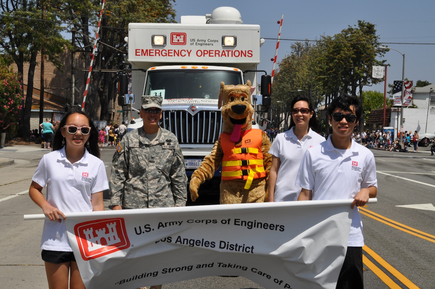 The District's new Emergency Command and Control Vehicle, operated by Alex Watt, made its debut appearance at the City of Torrance's 53rd Annual Armed Forces Day Celebration May 19 and was led by the District's commander, Col. Mark Toy, wife May, daughter Kayla and son Brandon.  The Toys carried the District's banner, followed by the ECCV, Fany Anderson of the District's safety office and Bobber the Water Safety Dog, along the two-mile parade route.