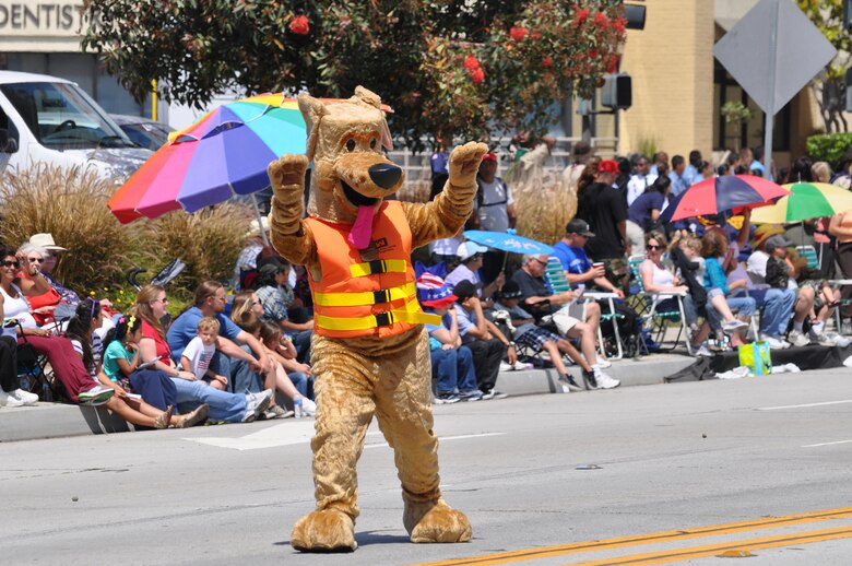 Bobber the Water Safety Dog waves at spectators along the two-mile parade route during the City of Torrance's Armed Forces Day Celebration May 19.