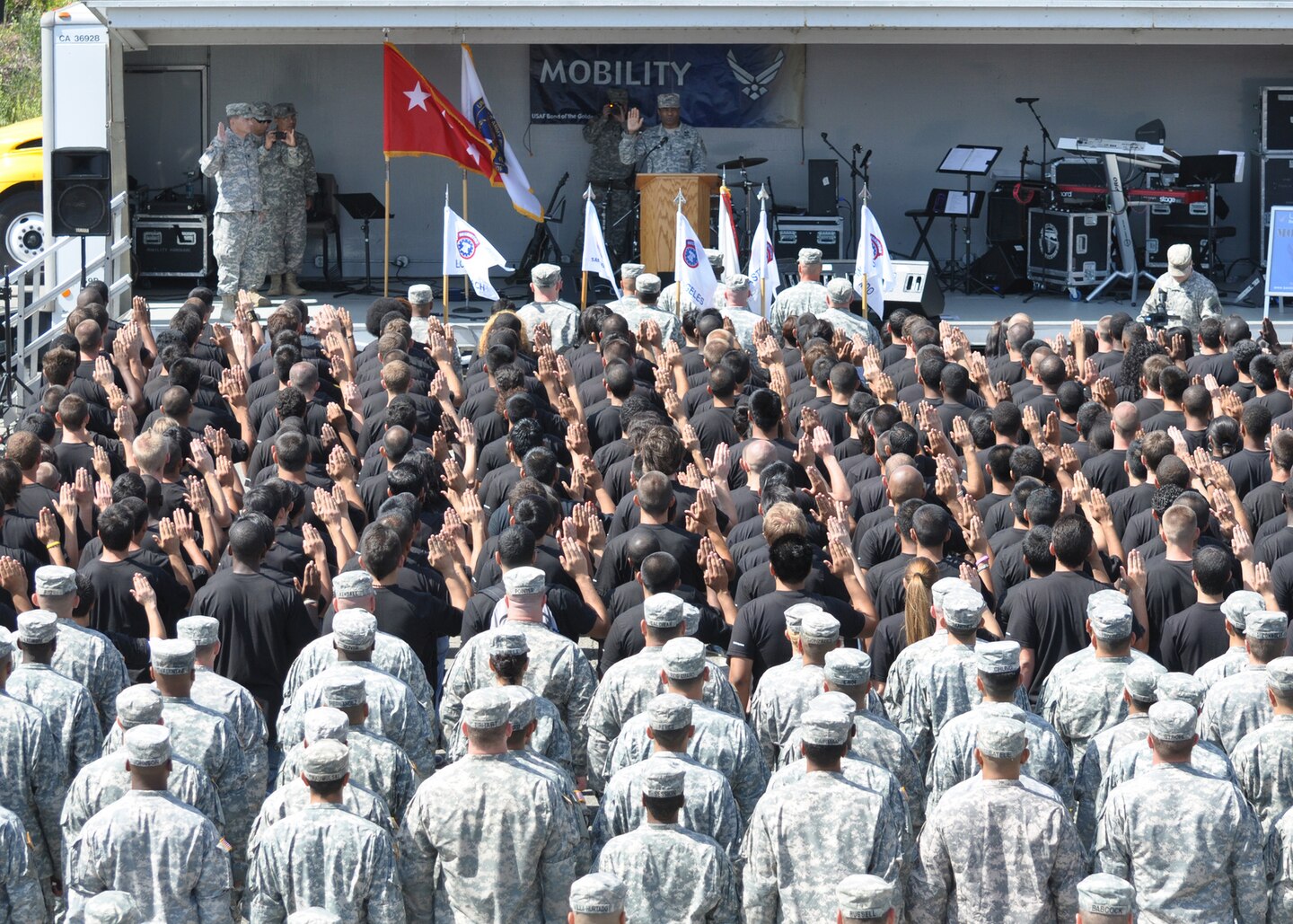Lt. Gen. Thomas Bostick, U.S. Army Deputy Chief of Staff, G-1, enlists area future soldiers in a public enlistment ceremony
as their families and friends watched as part of the City of Torrence's 53rd Annual Armed Forces Day Celebration May 19.
