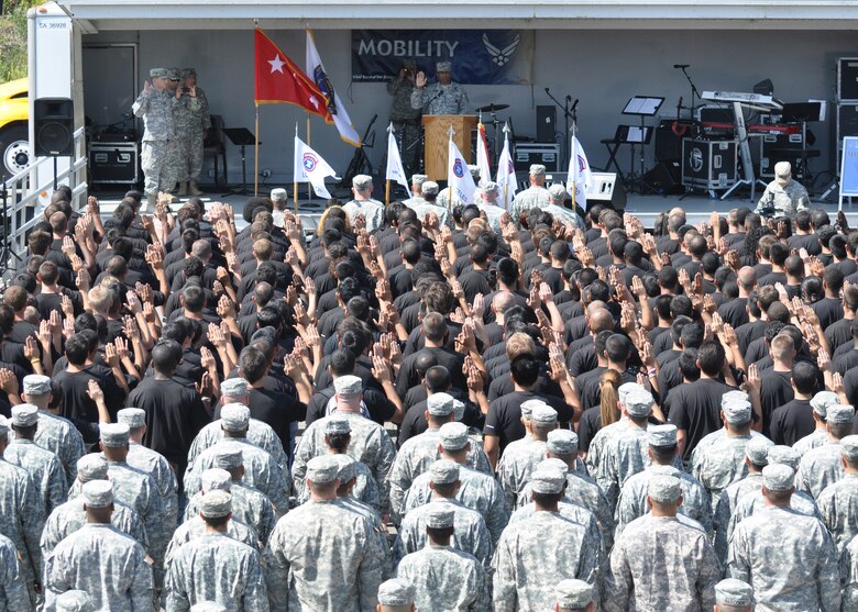 Lt. Gen. Thomas Bostick, U.S. Army Deputy Chief of Staff, G-1, enlists area future soldiers in a public enlistment ceremony
as their families and friends watched as part of the City of Torrence's 53rd Annual Armed Forces Day Celebration May 19.
