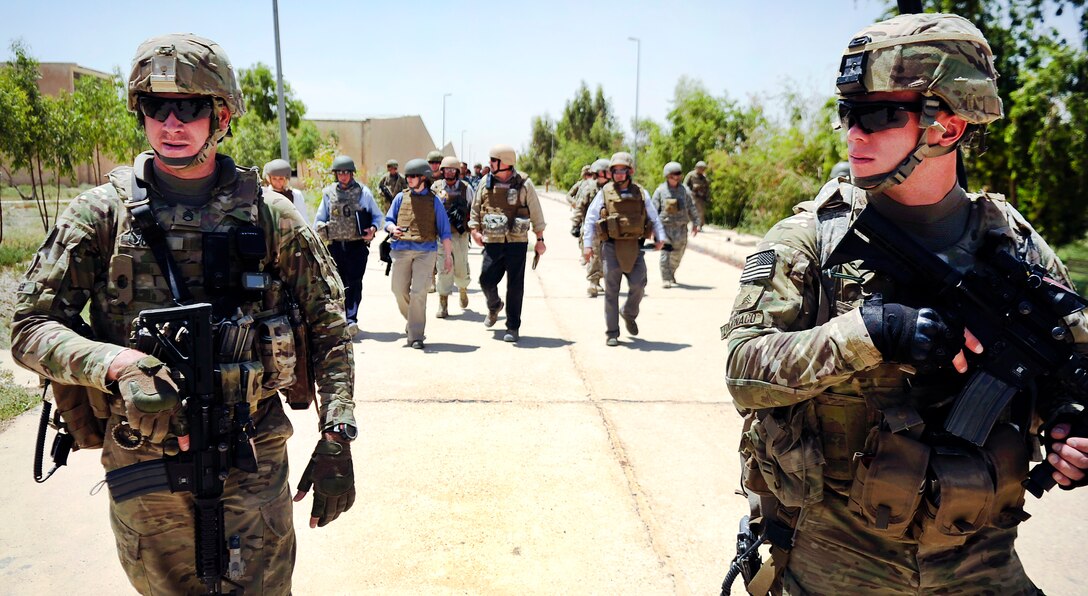 U.S. Army Staff Sgt. Edward Jones, left, and U.S. Army Sgt. Jacob LoMonaco provide security for a site survey in Afghanistan's Kandahar province, May 23, 2012. Jones and 
LoMonaco are assigned to the Kandahar Provincial Reconstruction Team.
