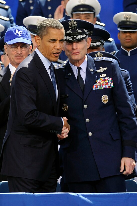 President Barack Obama speaks with Air Force Chief of Staff Gen. Norton A. Schwartz after delivering the commencement speech for the U.S. Air Force Academy's graduation ceremony at the academy in Colorado Springs, Colo., May 23, 2012.