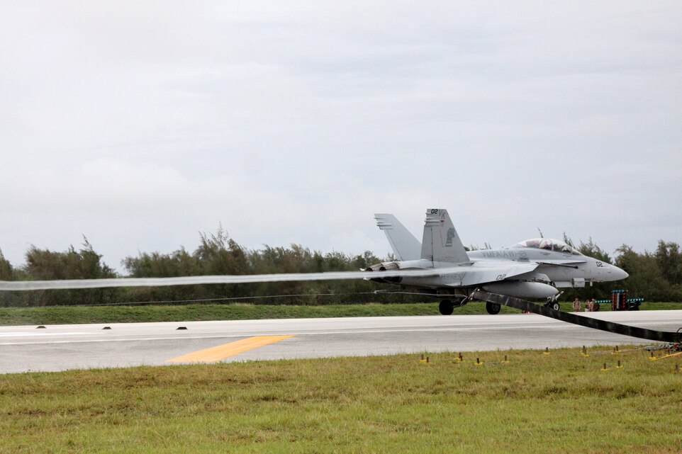 Marine All-Weather Fighter Attack Squadron 121 FA-18D Hornets are the first jets to land on Tinian May 23 during Exercise Geiger Fury 2012. The arresting gear instillation was set in coral terrain and the pilots of VMFA (AW) were the first to have ever made a coral arrestment.