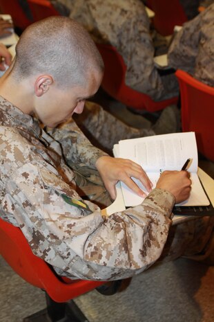 Company G recruits take notes during a Marine Corps history class May 11 aboard Marine Corps Recruit Depot. It is important recruits know the history of the Marine Corps so they understand the traditions. Many recruits come to the depot not knowing any of the knowledge they recieve during these classes.
