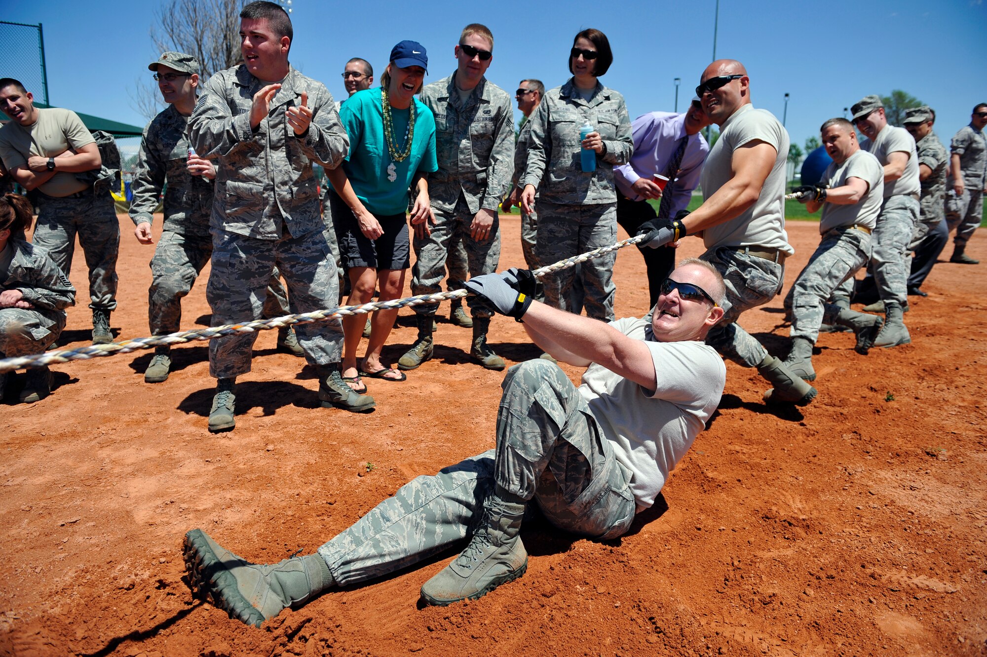 BUCKLEY AIR FORCE BASE, Colo. -- Col. Daniel Dant, 460th Space Wing commander, and other members of the 460th SW Wing Staff compete in a tug-of-war competition May 24, 2012. 460th SW Wing Staff lost their first bout to the 460th SW Security Forces Squadron. (U.S. Air Force photo by Staff Sgt. Kathrine McDowell)