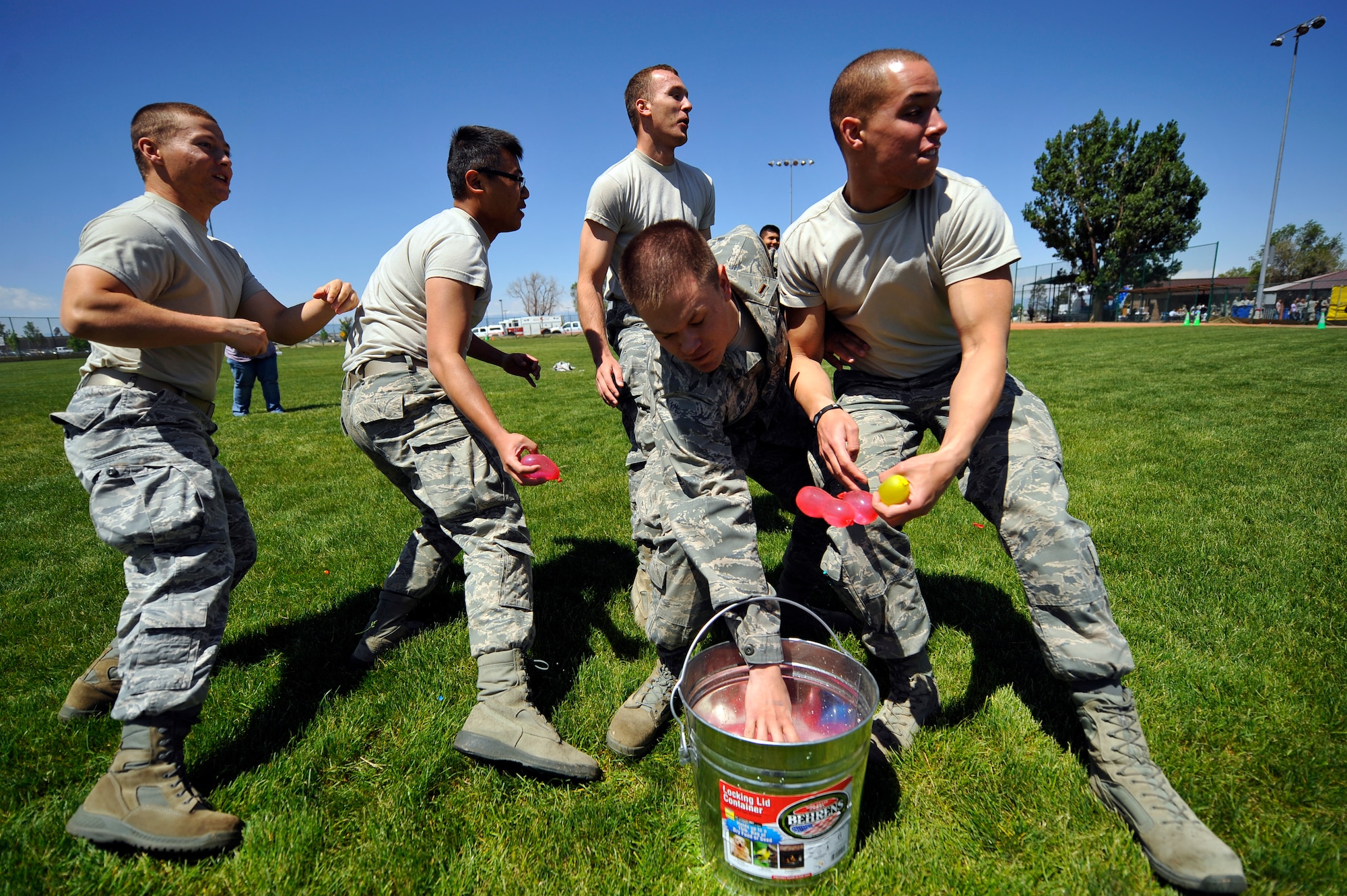 BUCKLEY AIR FORCE BASE, Colo. -- 460th Space Wing members make their first move during a water balloon fight May 24, 2012. The 460th SW gathered together to celebrate earning an "Excellent" rating during a recent Operational Readiness Inspection.  (U.S. Air Force photo by Staff Sgt. Kathrine McDowell)