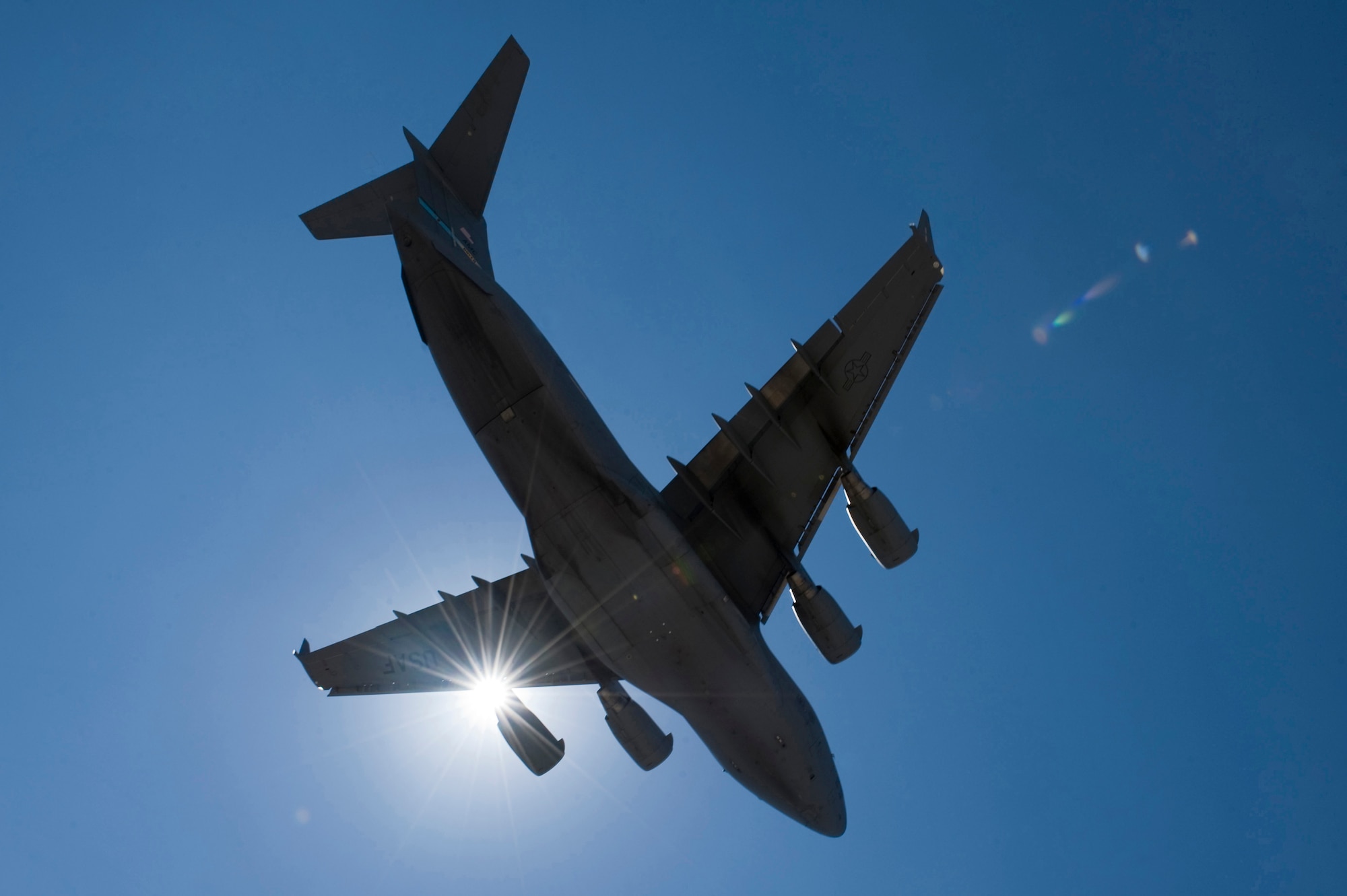 A U.S. Air Force C-17 Globemaster III prepares to land during a Mobility Air Forces Exercise Nov. 16, over the Nevada Test and Training Range. The U.S. Air Force Weapons School holds MAFEX twice a year to test the ability of C-17 Globemaster and C-130 Hercules aircrews from Air Force bases around the world to join together in a formation at a specific time and location to insert ground forces anywhere in the world. (U.S. Air Force photo by Airman 1st Class Daniel Hughes)

