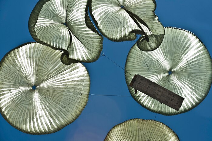 U.S. Air Force equipment from the 820th RED HORSE Squadron, descends for support during Mobility Air Force Exercise  May 23, 2012, over the Nevada Test and Training Range. Members of the 820th RED HORSE Airborne Squadron are capable of parachuting into heavily damaged airfields and rapidly returning them to service for use by friendly forces. (U.S. Air Force photo by Airman 1st Class Daniel Hughes)