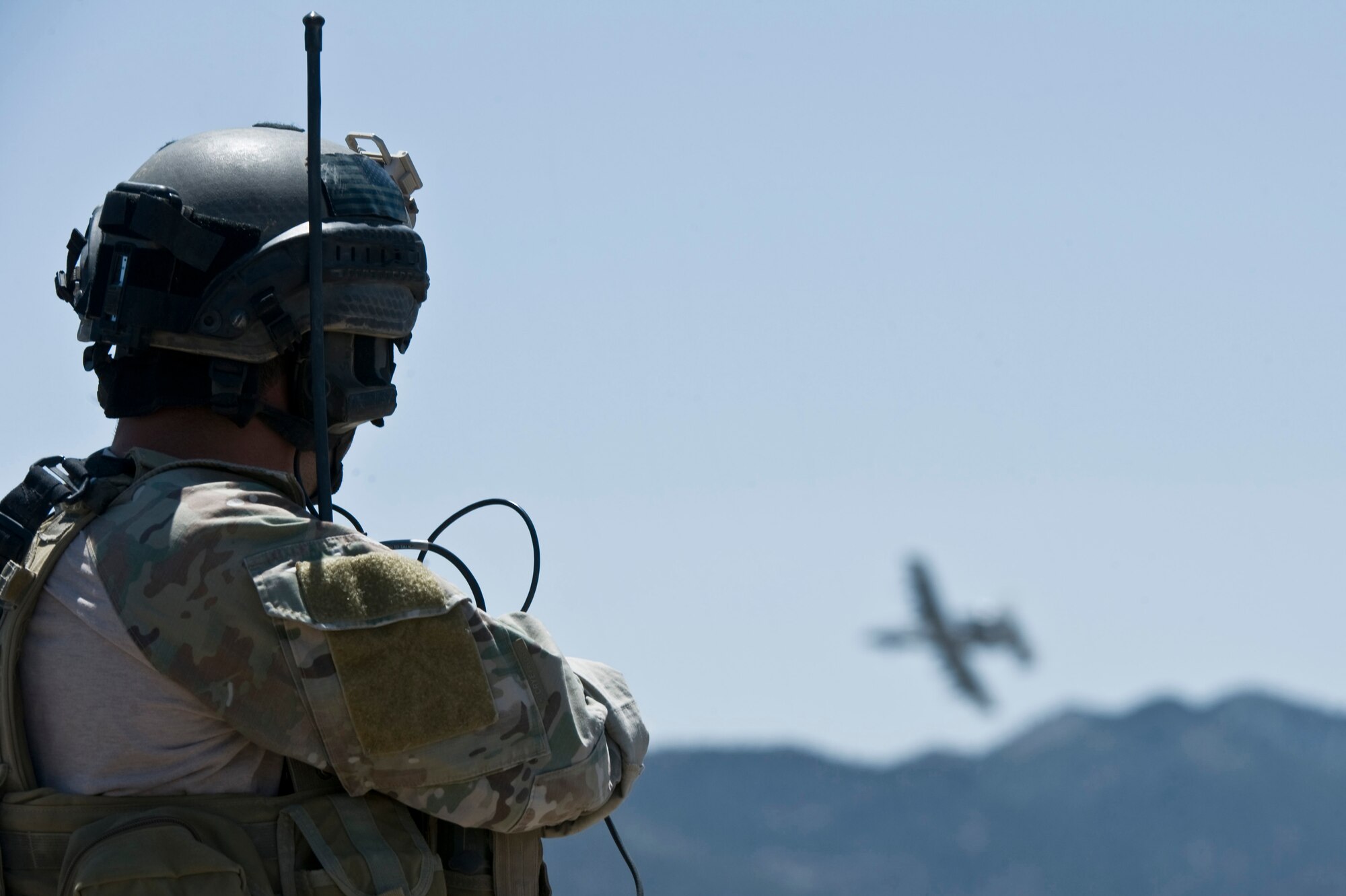 U.S. Air Force Staff Sgt. Colby Fulton, 23rd Special Tactics Squadron combat controller from Hurlbert Air Force Base, Fla., watches an A-10 Warthog provide low air support during Mobility Air Forces Exercise May 23, 2012, on the Nevada Test and Training Range. Combat controllers are in constant contact with pilots. (U.S. Air Force photo by Airman 1st Class Daniel Hughes)