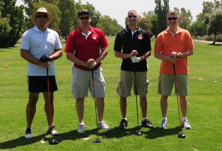 Leadership members of the 940th Reserve Wing pose for a picture during the Beale Military Liaison Committee golf tournament at the Coyote Run Golf Course here May 18. More than 100 members of Team Beale participated in the 18-hole event. (U.S. Air Force photo by Senior Airman Allen Pollard/Released) 

