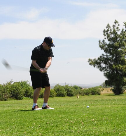 Col. Phil Stewart, 9th Reconnaissance Wing commander, tees off during the Beale Liaison Committee golf tournament at the Coyote Run Golf Course here May 18. All proceeds from the event will benefit quality of life improvements for Beale Airmen. (U.S. Air Force photo by Senior Airman Allen Pollard/Released)   