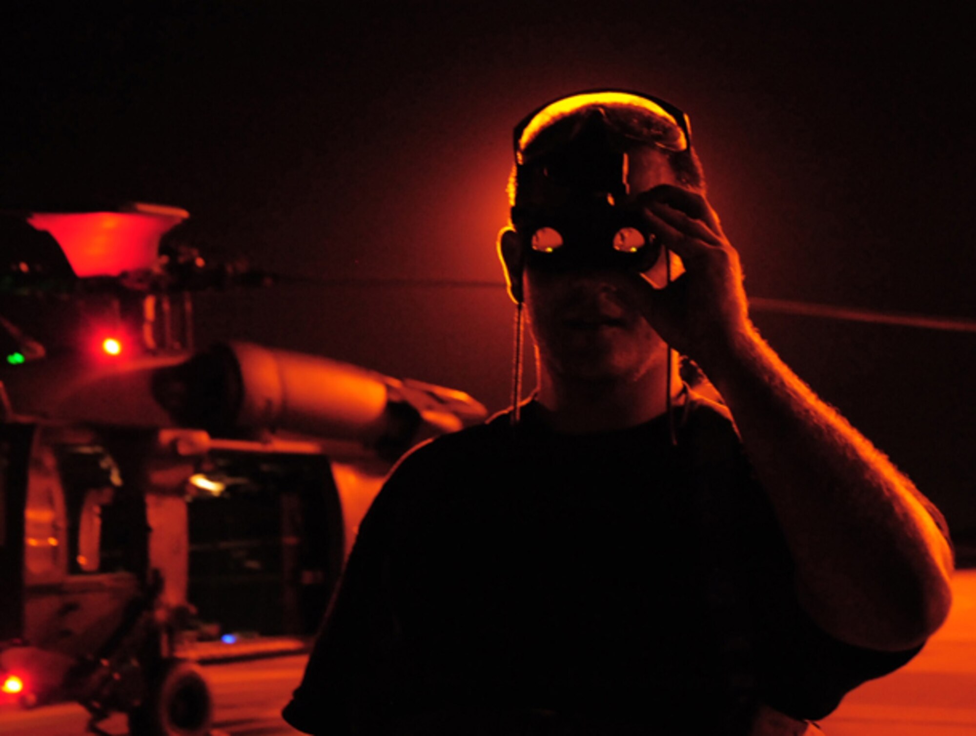 Mike Killian, ARES Institute and AmericaSpace reporter/photographer covers a  920th Rescue Wing rocket launch mission May 22 at Patrick Air Force Base, Fla. Aircrew Life Support Airmen issued him night vision goggles to allow him to see during the mission. He flew along with the Airmen on their range clearing mission aboard an HH-60G Pave Hawk helicopter to support a milestone rocket launch. Several hours prior to a Falcon 9 rocket launch, Airmen secured the Eastern Range for the first ever commercial mission to the International Space Station. (U.S. Air Force photo/Capt. Cathleen Snow)