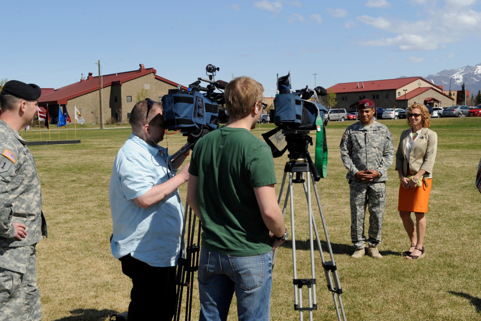 JOINT BASE ELMENDORF-RICHARDSON,Alaska -- Army Maj. Gen. Michael Garrett and wife are interviewed by local news media before the U.S. Army Alaska change of command ceremony.  (USAF Photo by Steven White/JBER/PA)