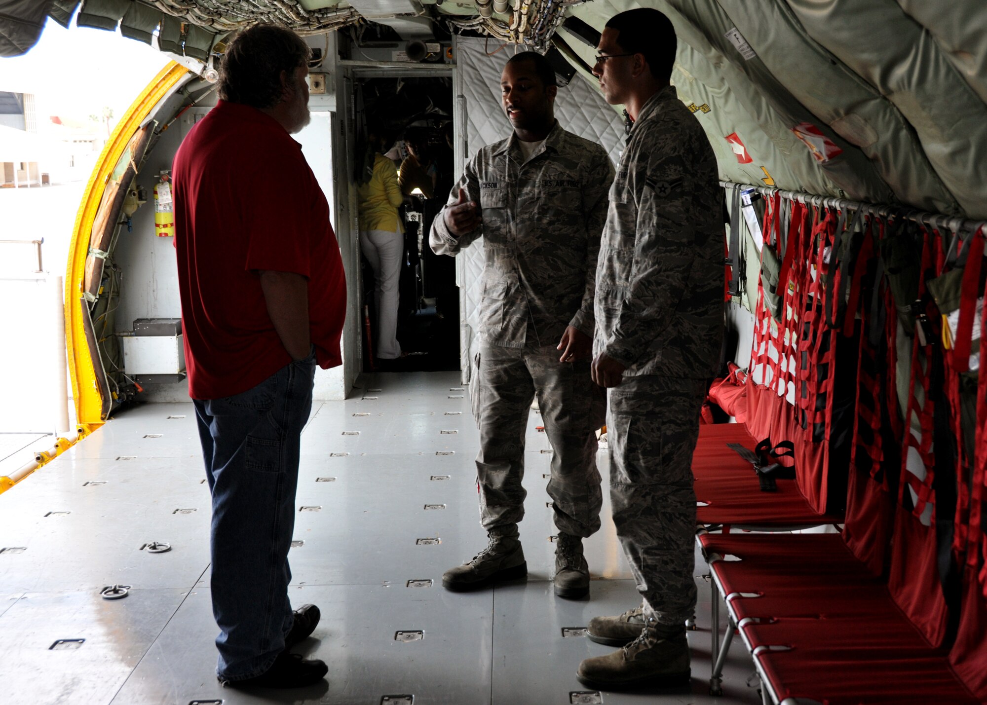 Civic leader Chris Norman meets, from left, Senior Airman Allen Jackson and Airman 1st Class Ryan Baez, 6th Aircraft Maintenance Squadron, while aboard a parked KC-135 Stratotanker at MacDill AFB, Fla., recently.  Each year, the 919th Special Operations Wing conducts a civic leader tour to help its community neighbors broaden their perspective of Air Force active duty and Reserve worldwide missions. (U.S. Air Force photo/Tech. Sgt. Jasmin Taylor)