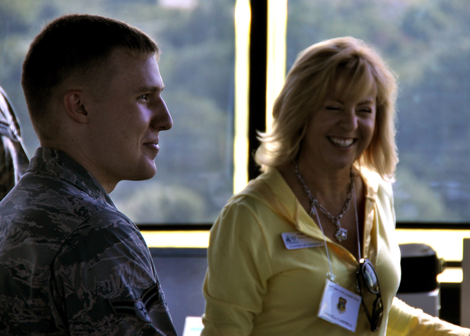 Airman 1st Class Christian Smith, 6th Operations Support Squadron, talks with Angela Campbell, a Santa Rosa County civic leader, in the tower at MacDill AFB, Fla., recently. Each year, the 919th Special Operations Wing conducts a civic leader tour to help its community neighbors broaden their perspective of Air Force active duty and Reserve worldwide missions. (U.S. Air Force photo/Tech. Sgt. Jasmin Taylor)