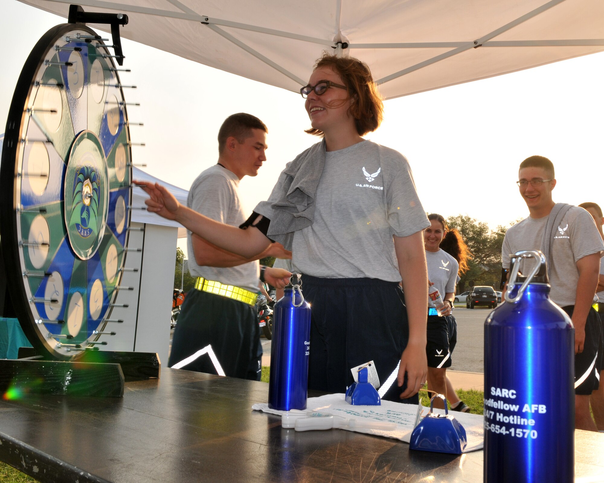 GOODFELLOW AIR FORCE BASE, Texas – Airman Rebecca Montgomery, 315th Training Squadron student spins the wheel to answer a Sexual Assault Response Coordinator question for a chance to win a prize May 24. The event was put on by Students Against Sexual Assault and Harassment, one of many informational booths on display, during the Safety and Sports Day. (U.S. Air Force photo/ Staff Sgt. Tong Duong)