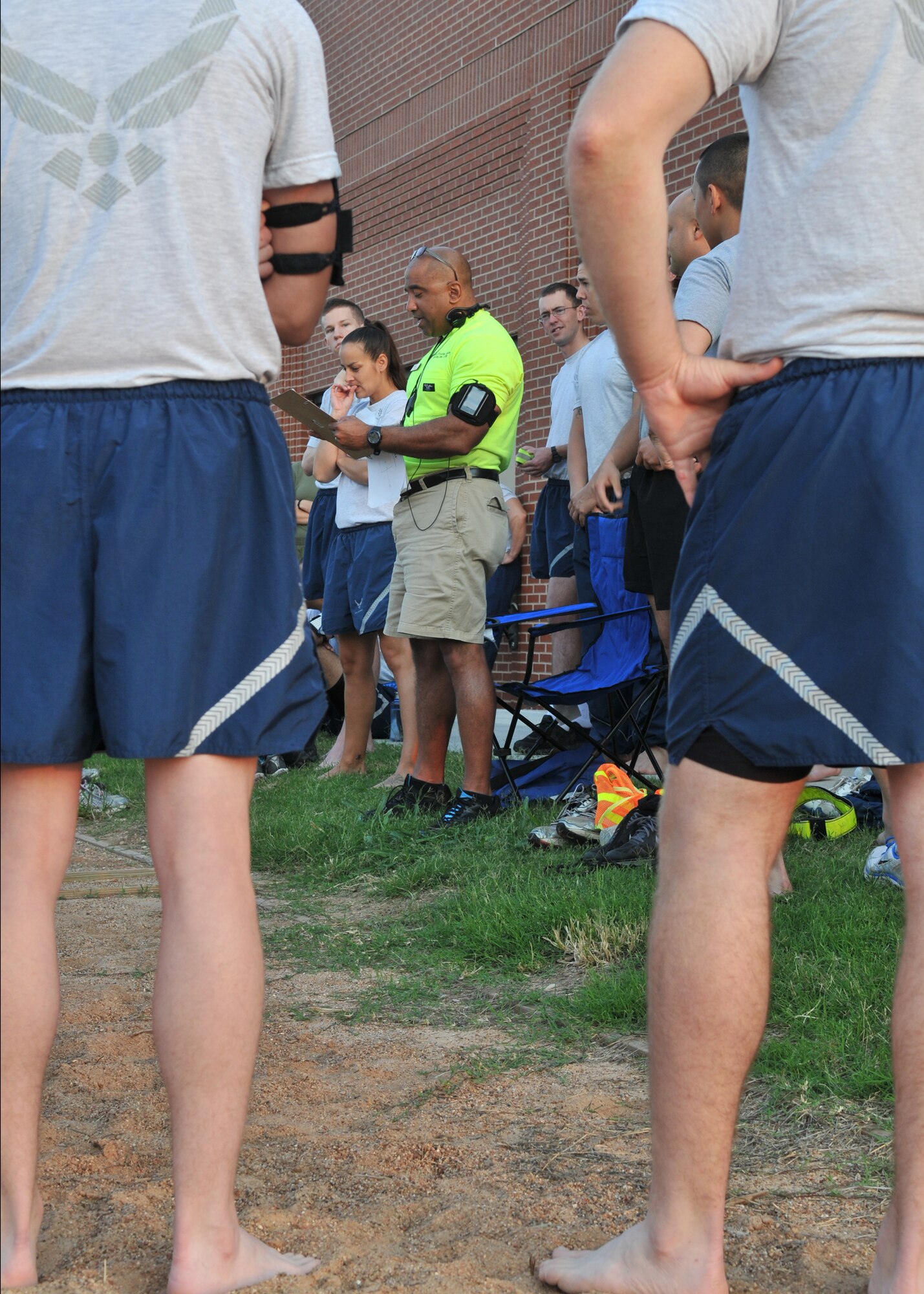 GOODFELLOW AIR FORCE BASE, Texas – Ernie Rudd, 17th Force Support Squadron Fitness Director reads out instructions for 4-on-4 volleyball during Safety and Sports Day here May 24. Other events include basketball, softball, soccer, running and a timed combat obstacle course. (U.S. Air Force photo/ Staff Sgt. Tong Duong)