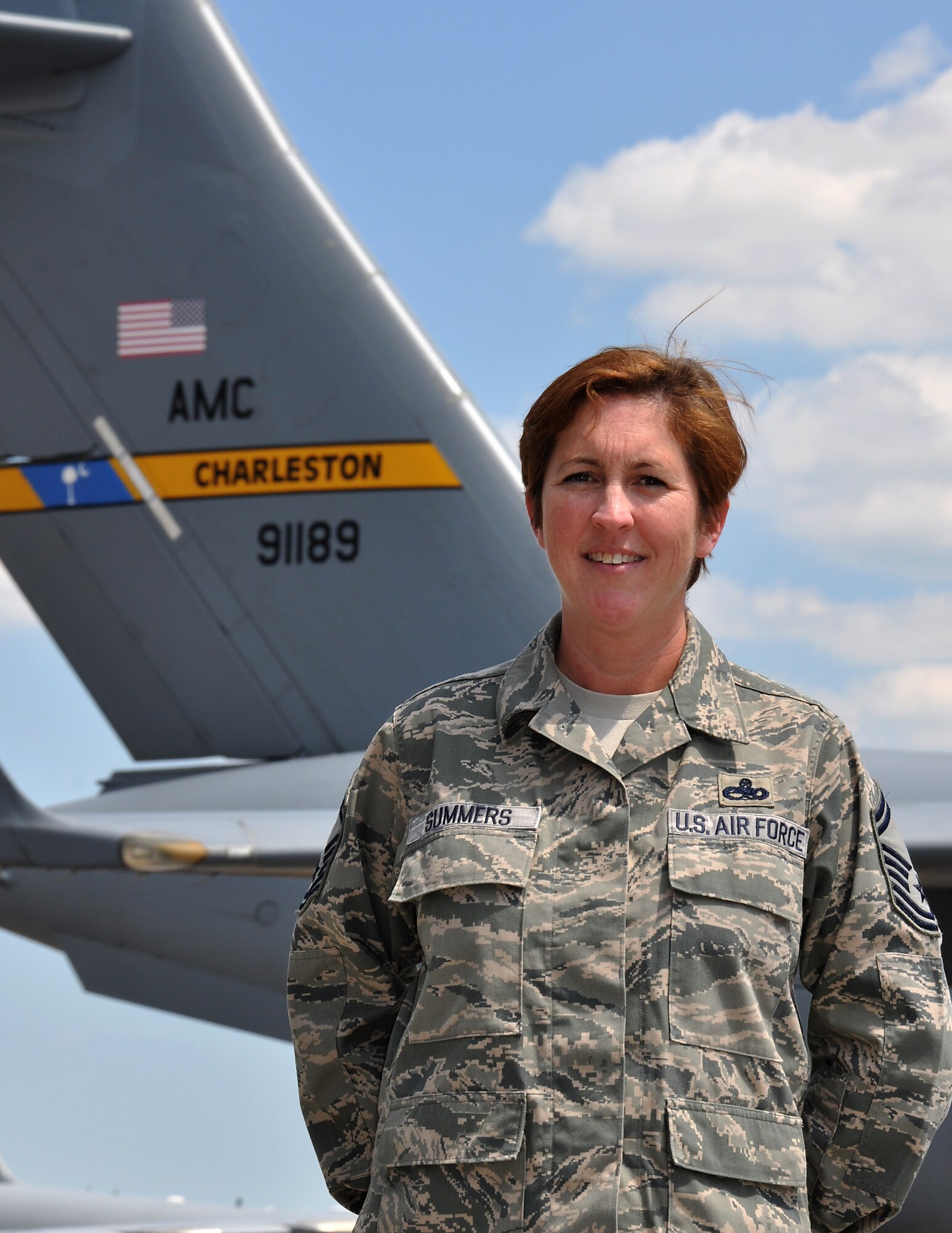 Senior Master Sgt. Michele Summers poses in front of a C-17 Globemaster III at Joint Base Charleston, S.C. May 10, 2012. Sergeant Summers was named the Charleston Metro Chamber of Commerce Reservist of the Year May 23 during the Chamber’s 2012 Salute to the Military at the Charleston Area Convention Center in North Charleston, S.C. Sergeant Summers is a 315th Airlift Wing production superintendent. (U.S. Air Force Photo/Michael Dukes)