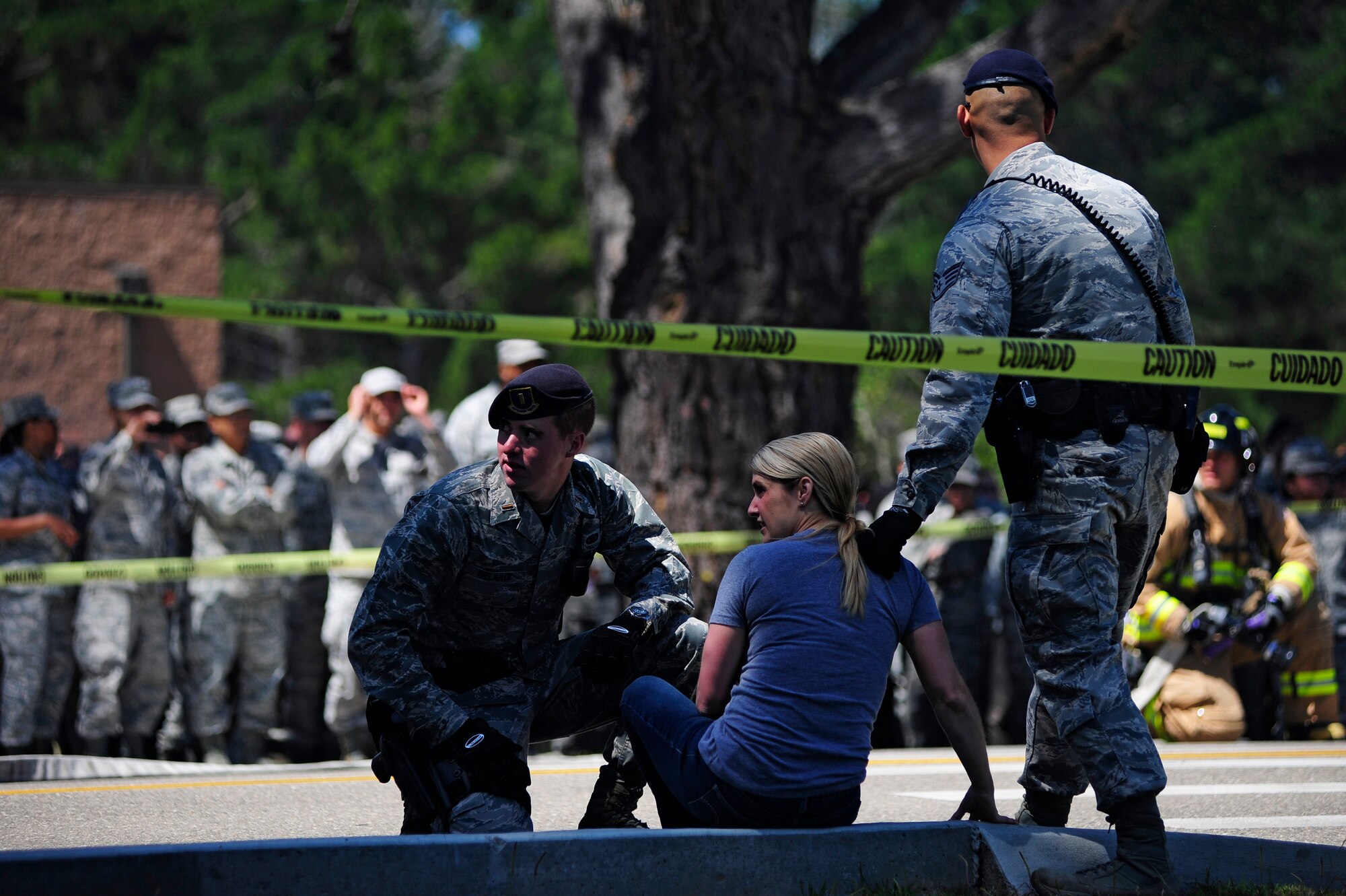 VANDENBERG AIR FORCE BASE, Calif. -- Team V emergency personnel respond to a staged drunk driving accident in front of the Base Fitness Center here Thursday, May 24, 2012. Airmen Against Drunk Driving teamed up with Vandenberg first responders to give base personnel a firsthand experience with the immediate consequences of impaired driving. This event concluded a week of outreach activities to raise awareness on the importance of safety during the Critical Days of Summer. (U.S. Air Force photo/Michael Peterson)