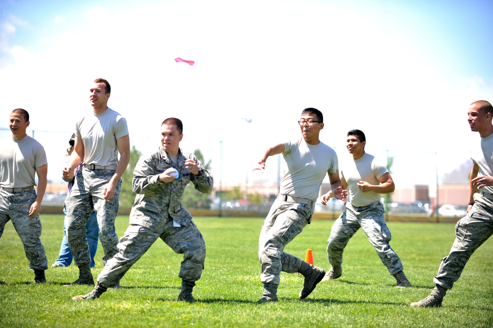 BUCKLEY AIR FORCE BASE, Colo. -- Military members participate in a water balloon fight May 24, 2012. Members of Team Buckley participated in a day of activities celebrating their excellent rating during a recent Operational Readiness Inspection. (U.S. Air Force Photo/ Senior Airman Paul Labbe)
